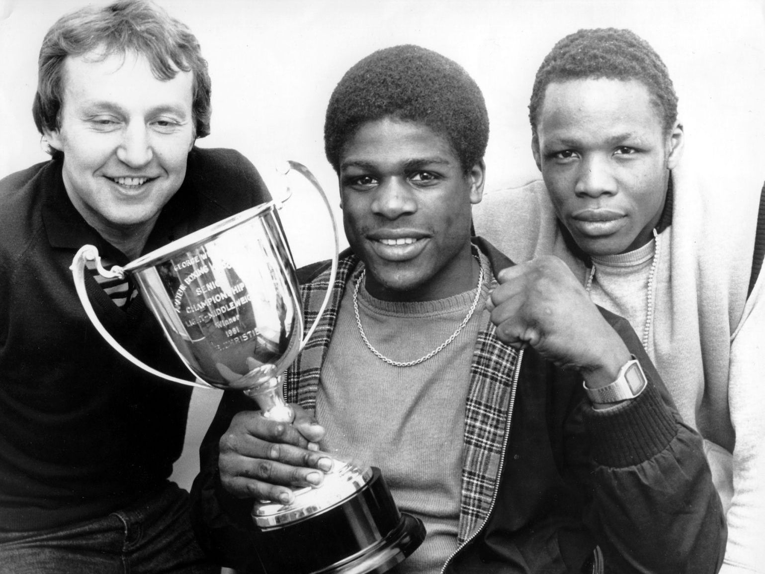 Christie with his trainers and the ABA light-middleweight trophy, in 1981