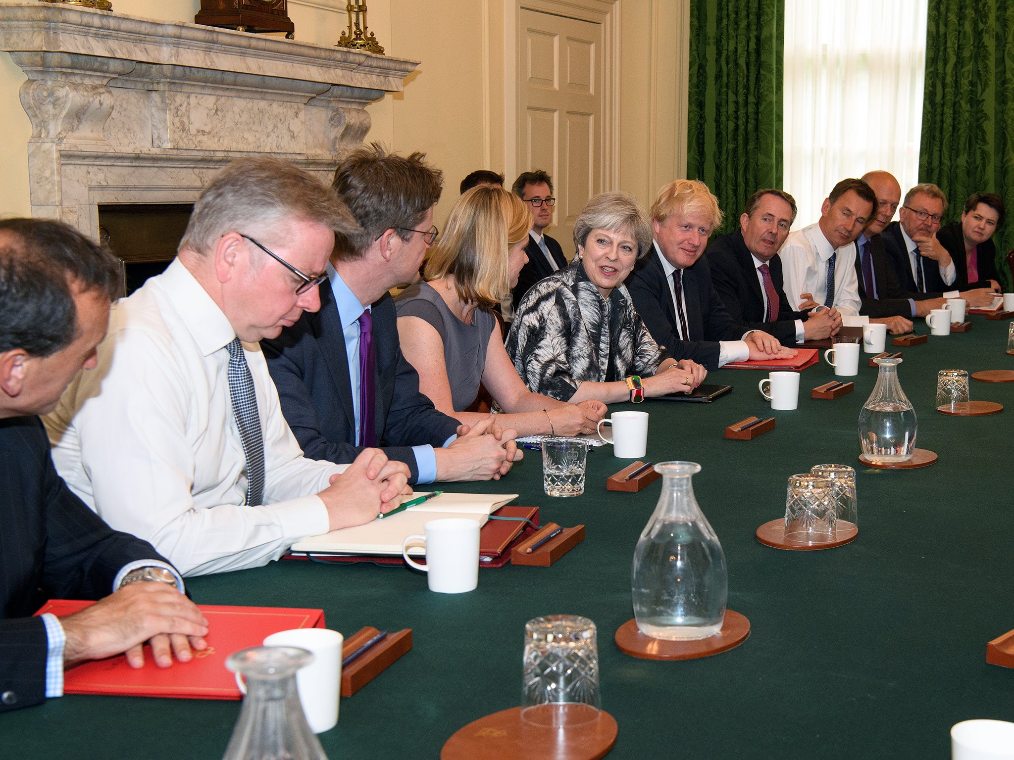 Theresa May hosts the first cabinet meeting of her new team on Monday