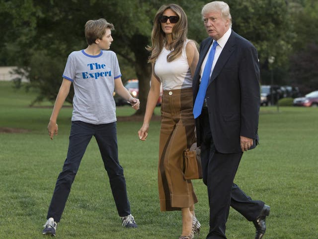 President Donald Trump, first lady Melania and their son Barron arrive at the White House