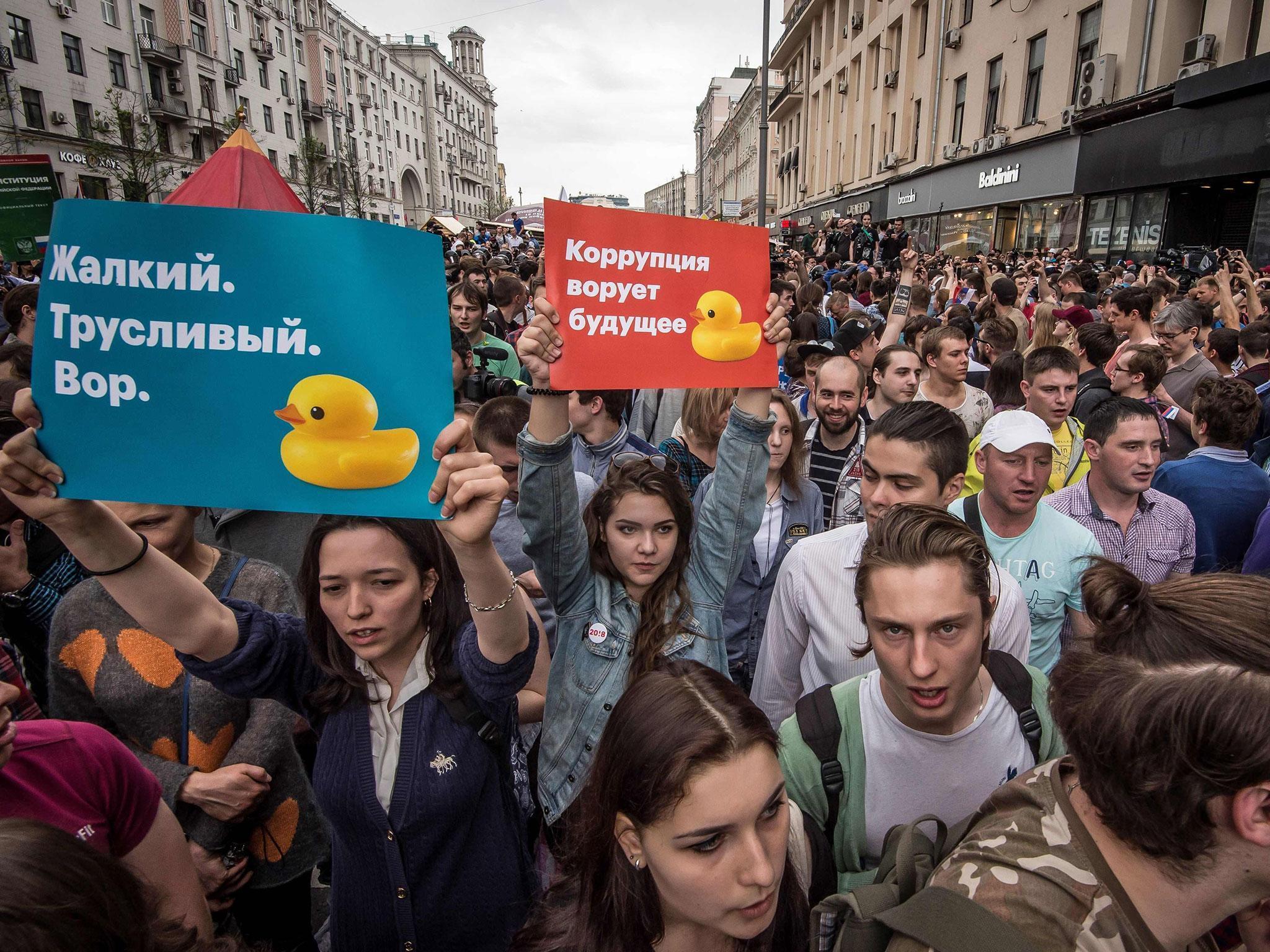 Posters reading 'Corruption steals the future' and 'Miserable cowardly thief' during the unauthorised opposition rally (MLADEN ANTONOV/AFP/Getty Images)