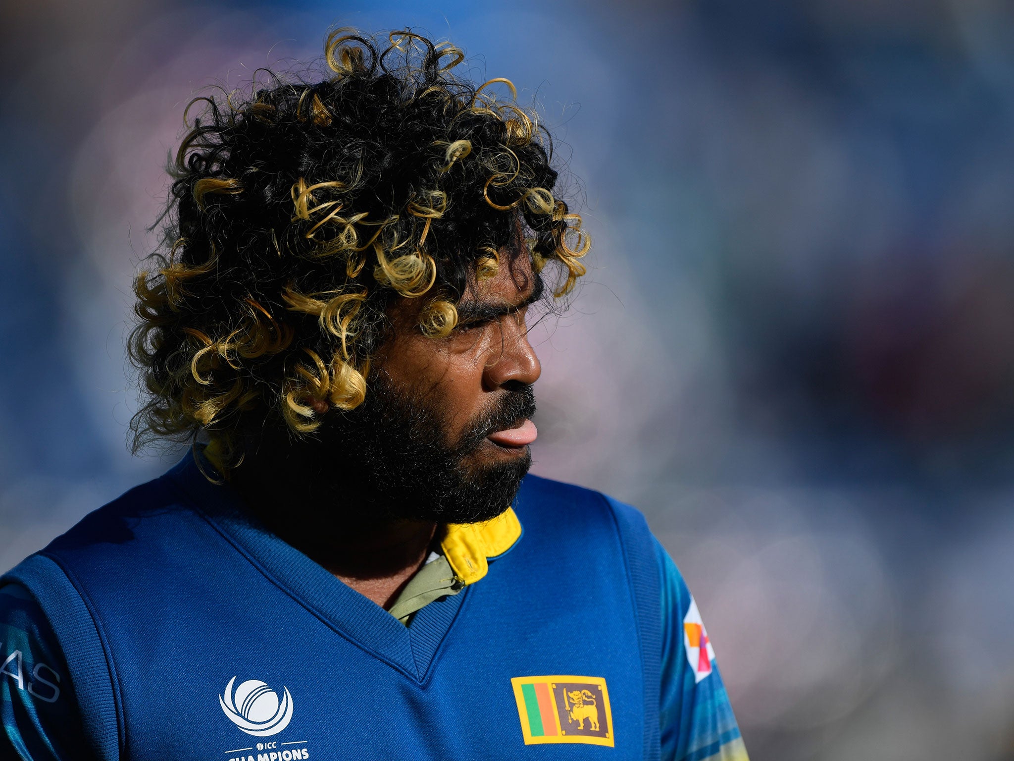 Lasith Malinga looks on after defeat