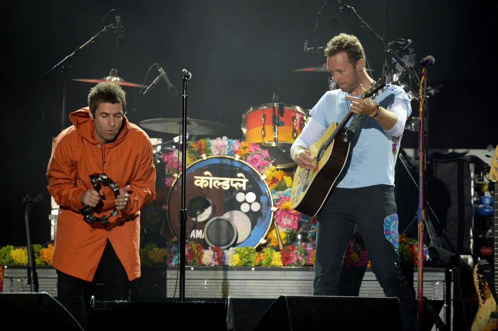 Liam Gallagher performs with Chris Martin at the One Love Manchester concert