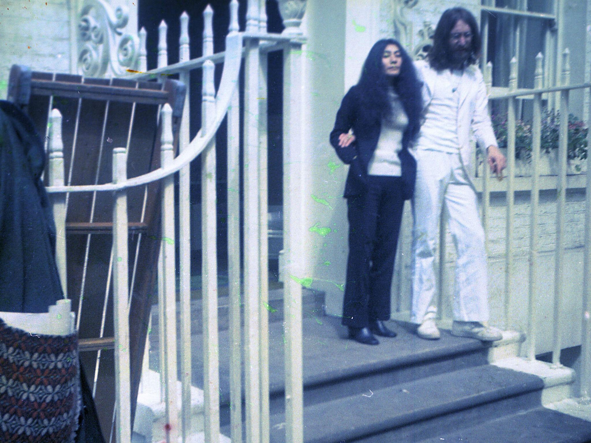 John Lennon and Yoko Ono on the steps of Apple Corps at 3 Saville Row in 1969