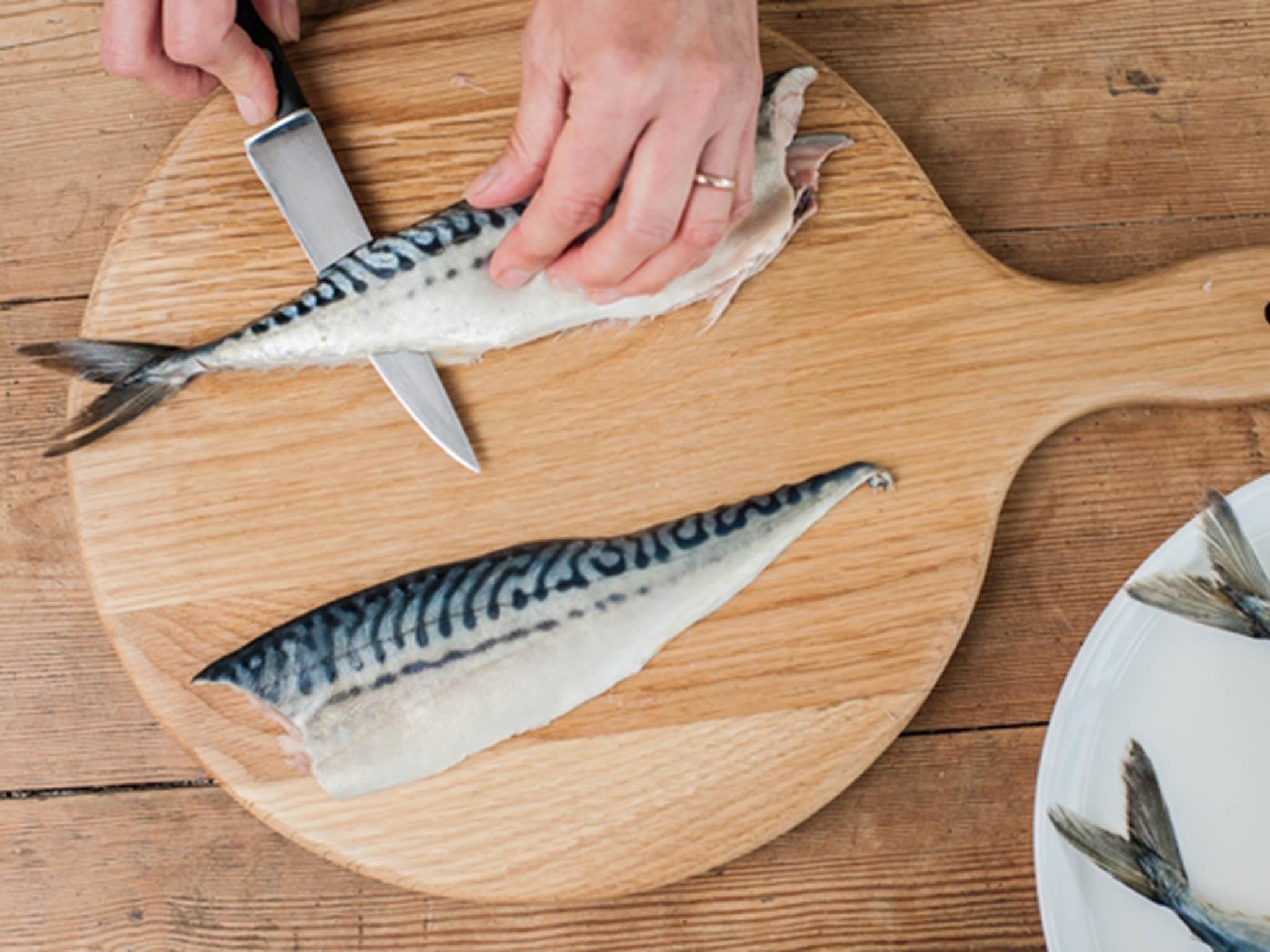 As you did before, cut the fillet away from the backbone, keeping the knife parallel to the board