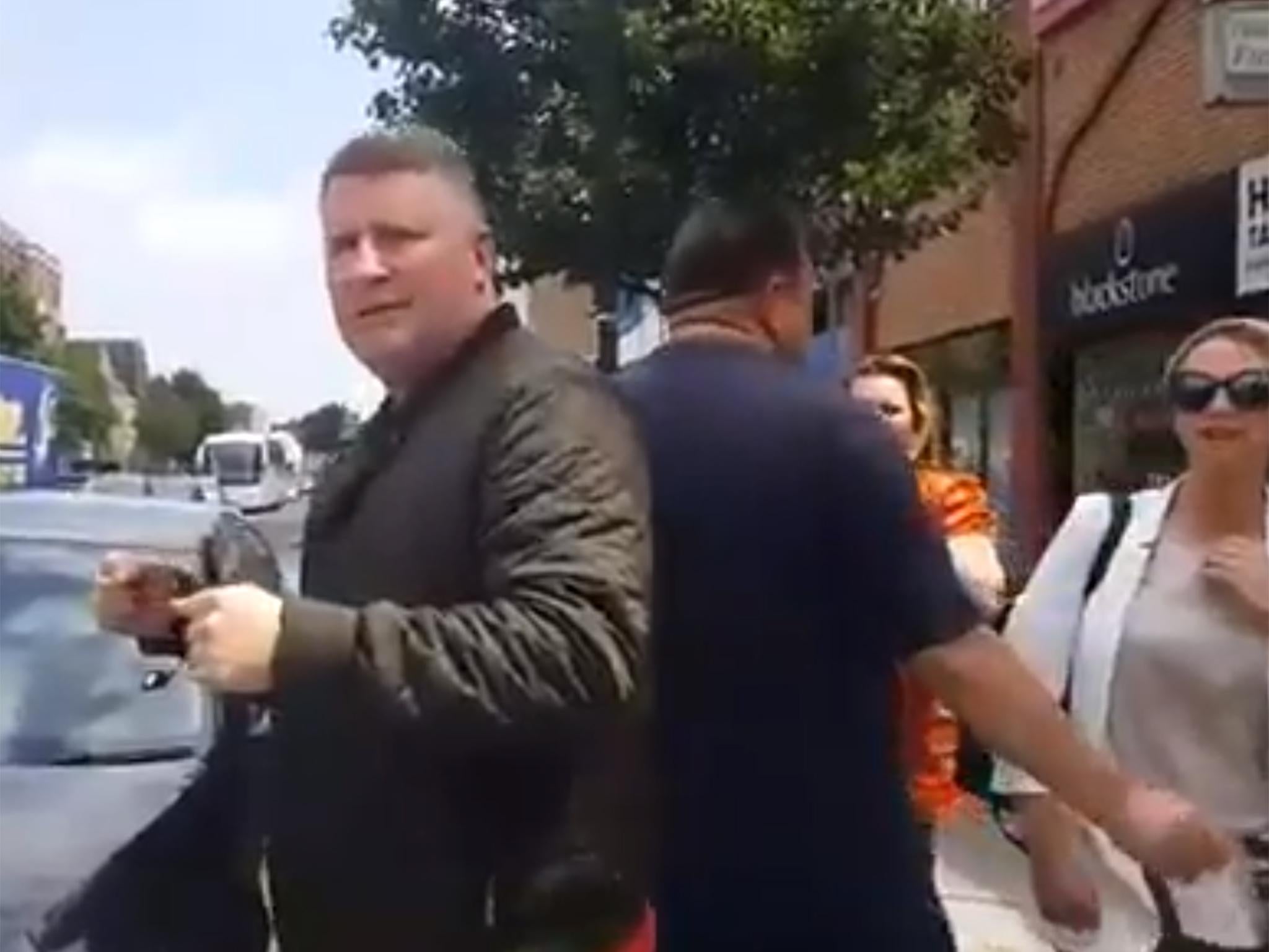 Footage shows Britain First leader, Paul Golding, standing outside the East London Mosque