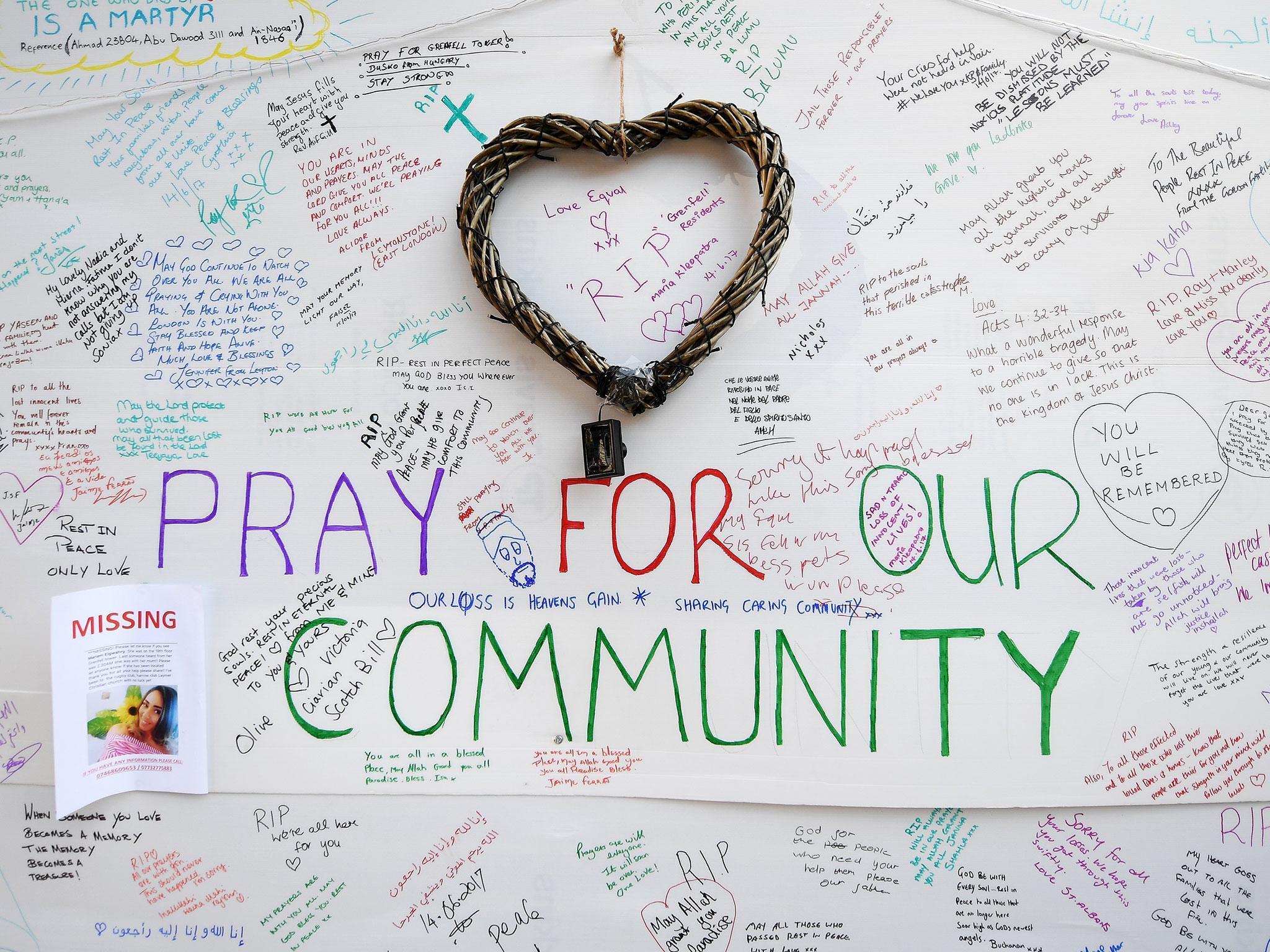 Messages of condolence left at a relief centre close to the scene of the fire (EPA/ANDY RAIN)