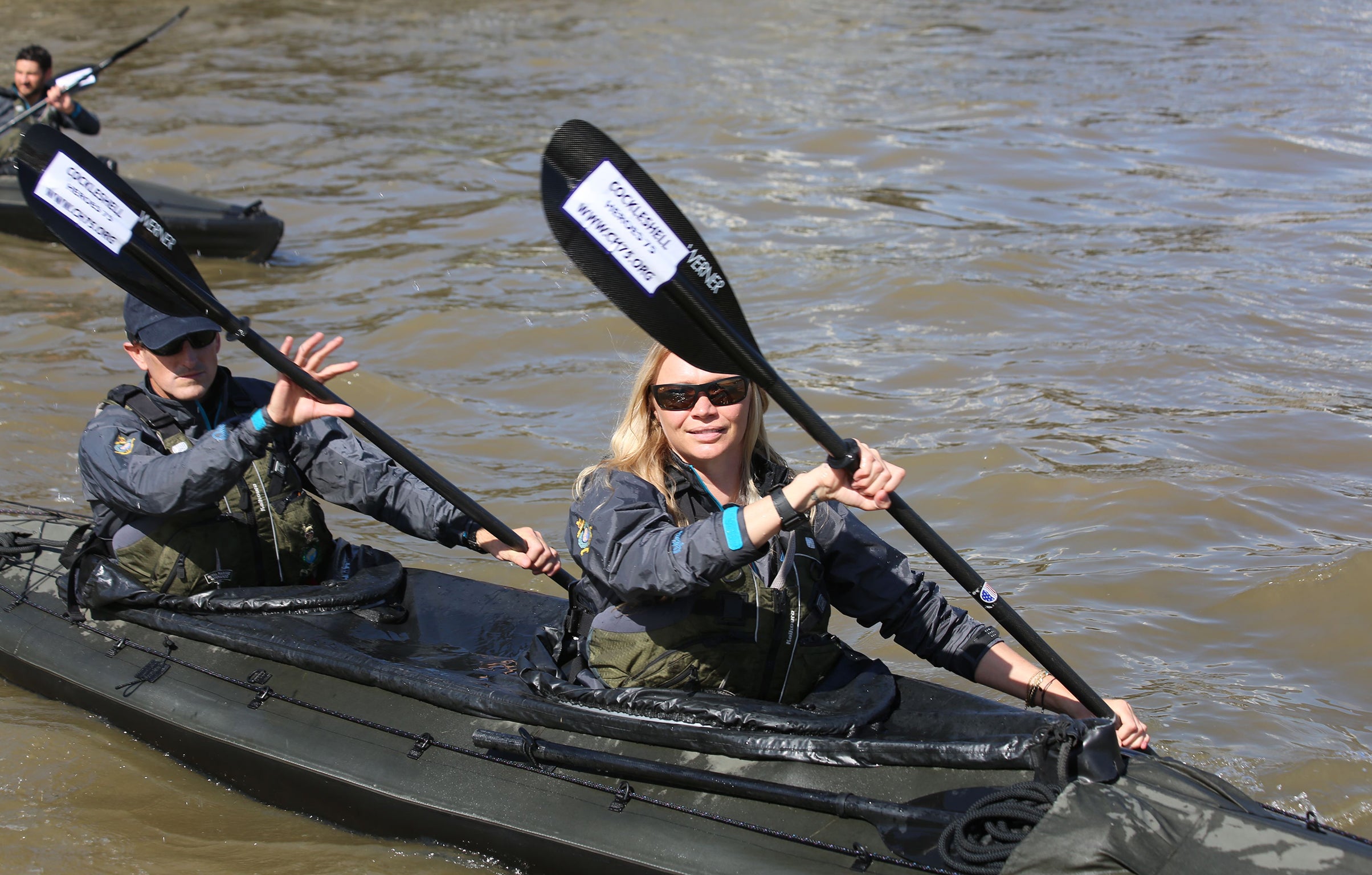 Jodie Kidd and members of the special boat service association recreate a training paddle in military canoes on the Thames