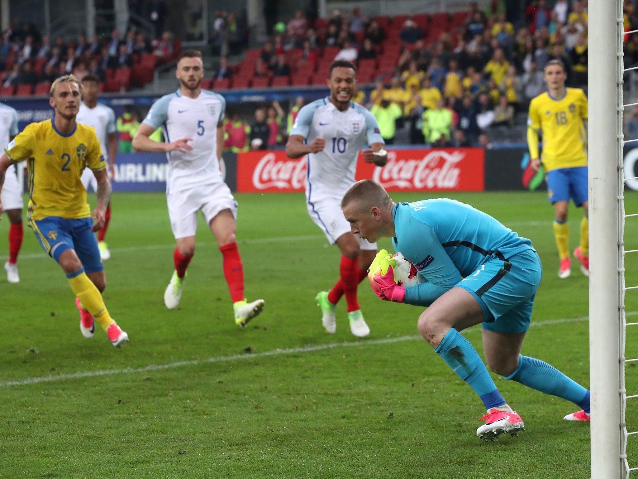 Jordan Pickford makes a save for England