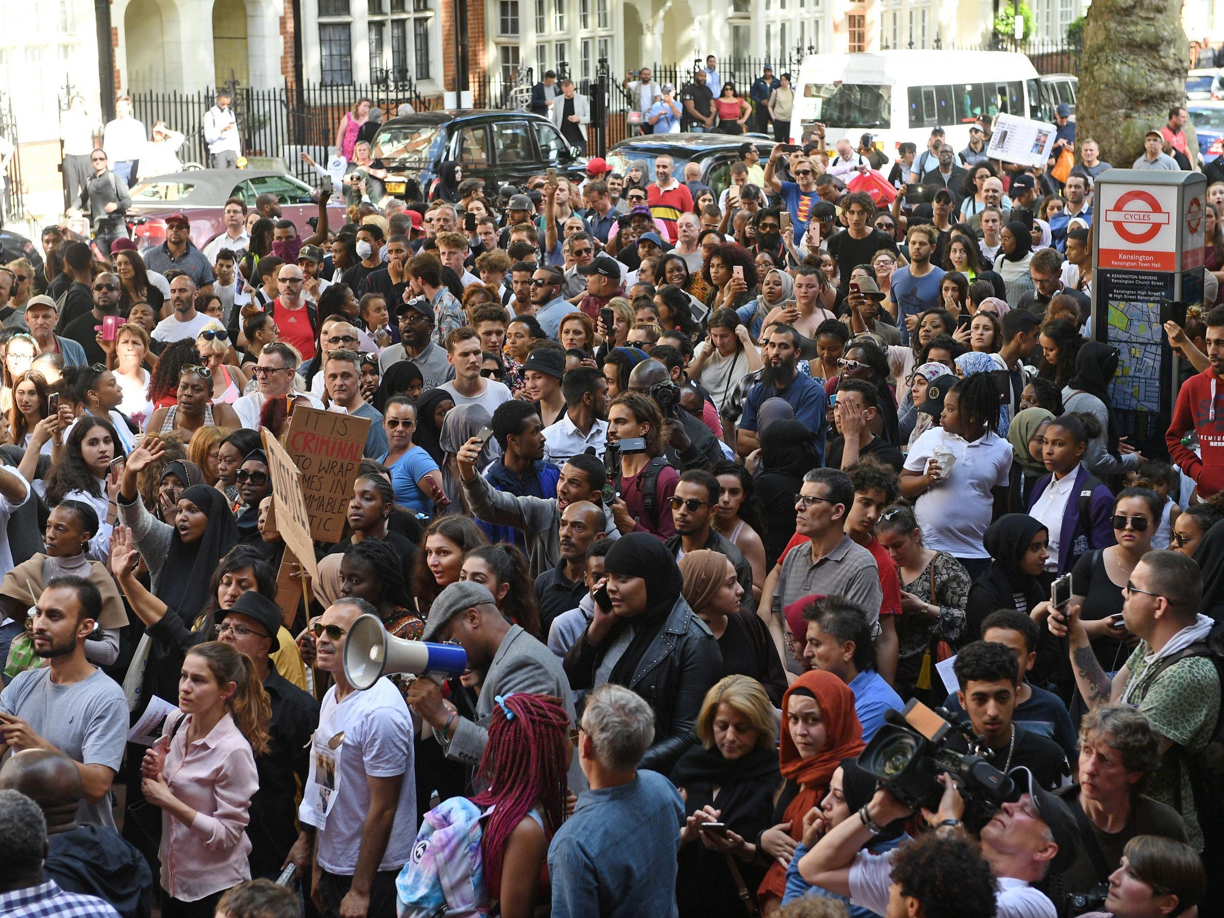 Protesters outside Kensington Town Hall, where the demands were handed over on Friday afternoon