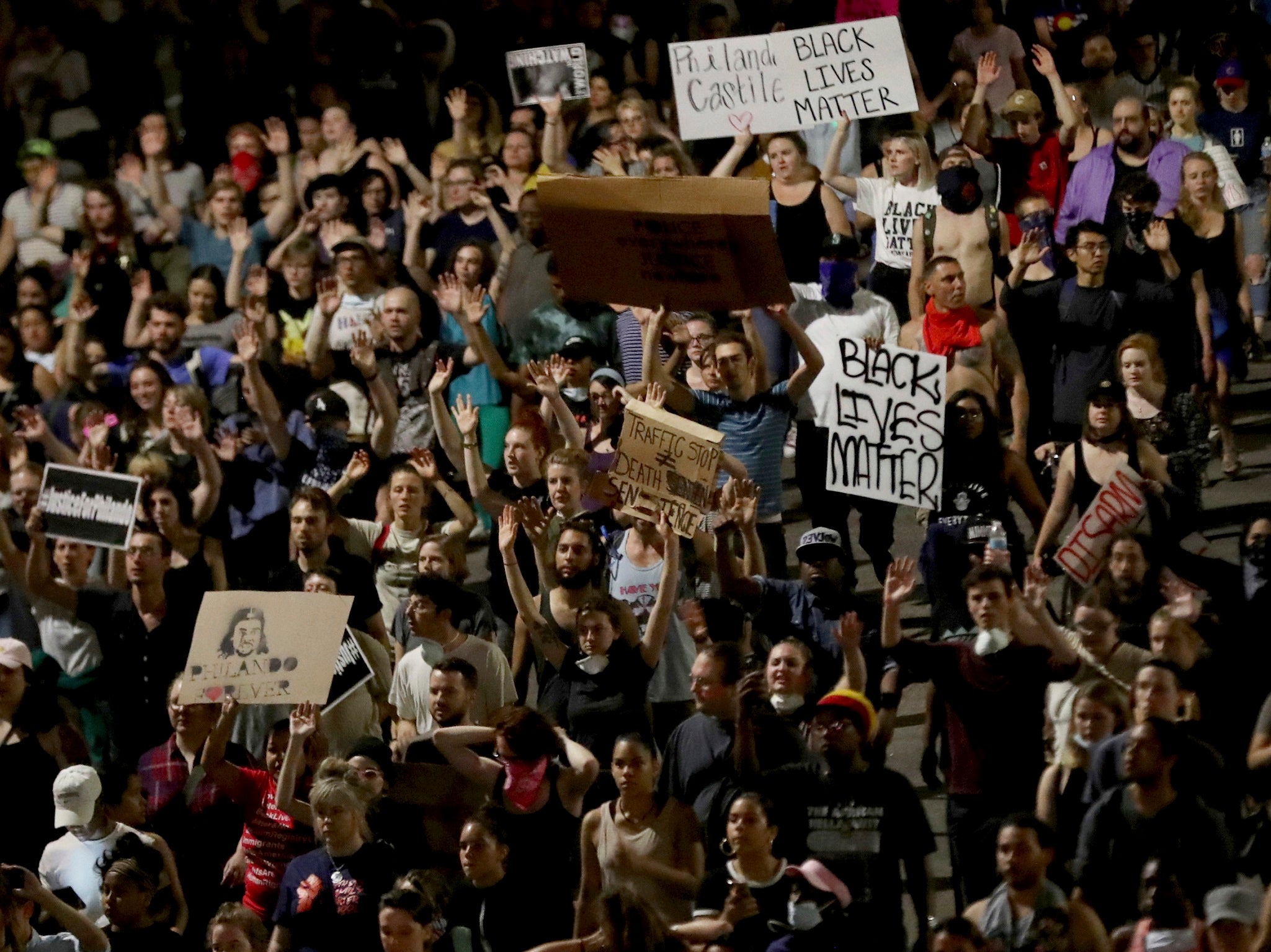 Demonstrators march and hold signs along Interstate 94 after a Minnesota police officer was cleared in the fatal shooting of Philando Castile