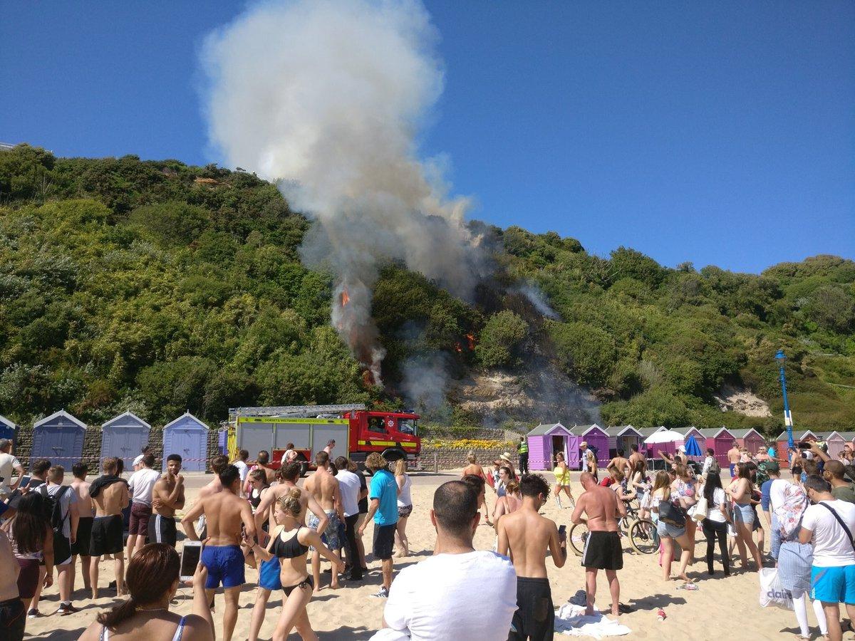 Fire crews tackled a blaze by Bournemouth beach on the hottest day of the year