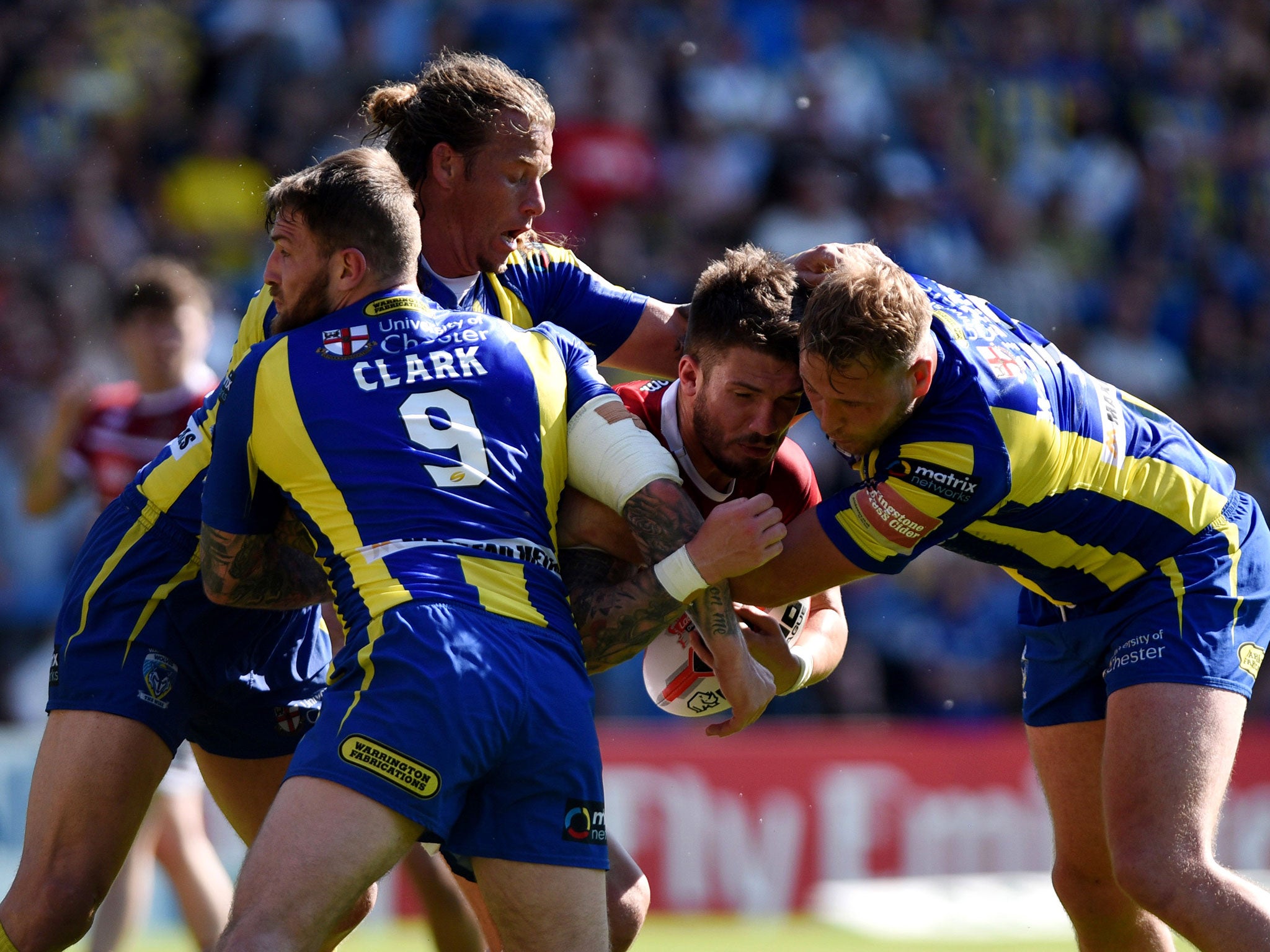 Oliver Gildart is held up by the Warrington defence