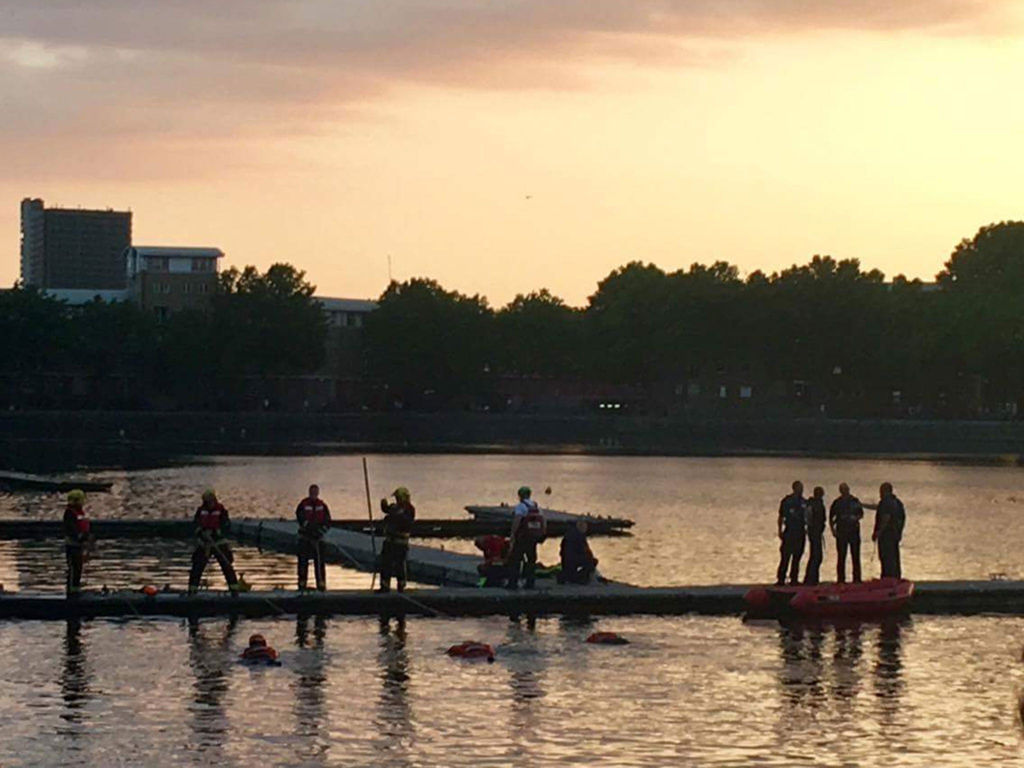 Emergency services searching for a missing 26-year-old man in Greenland Dock, London, on 17 June