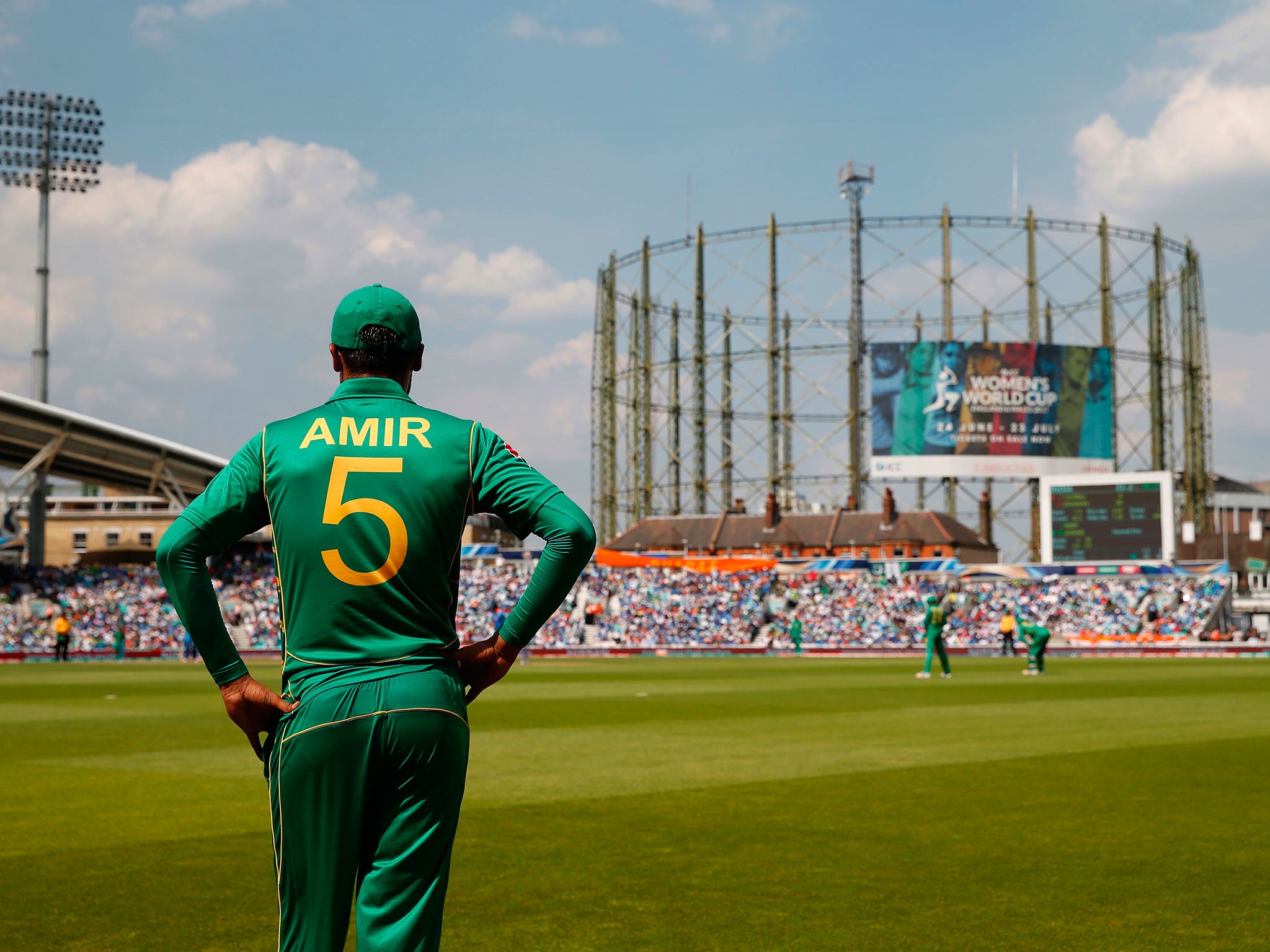 Mohammad Amir looks on from the boundary