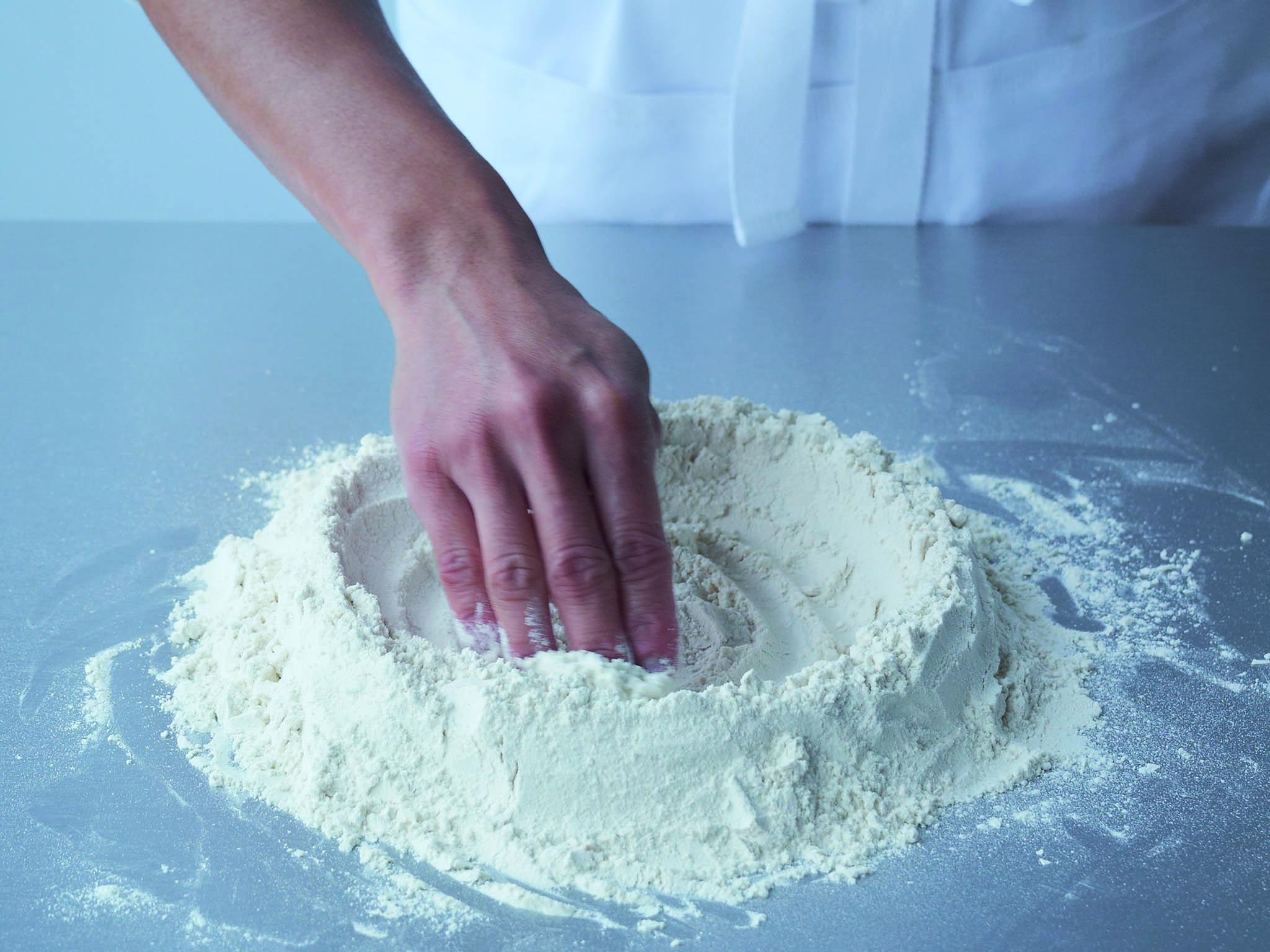 1. Sift the flour on to a clean work surface and make a well in the centre