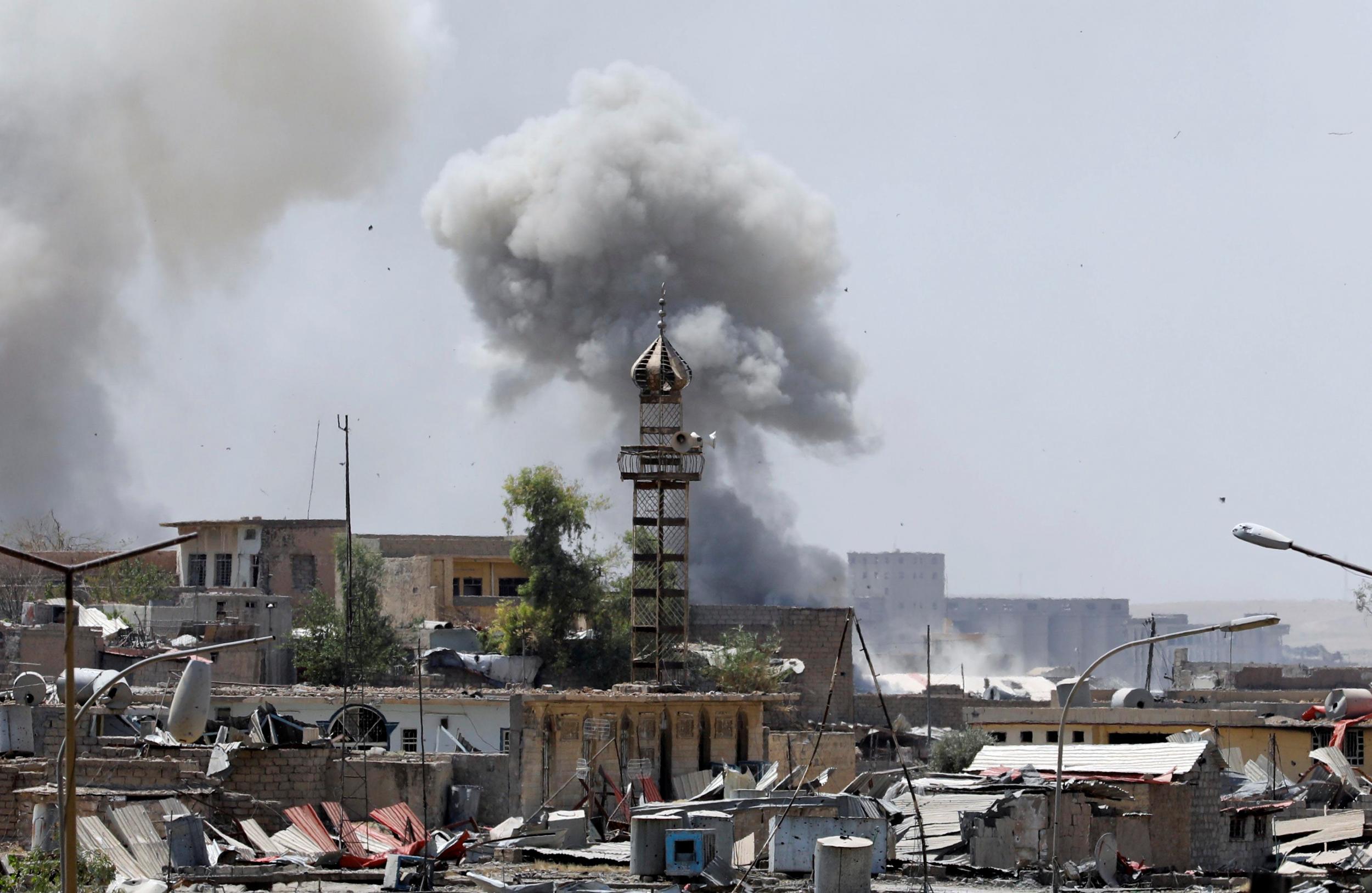 Smoke billows from an Isis position after an artillery attack by the Iraqi forces in western Mosul, Iraq, on 18 June 2017