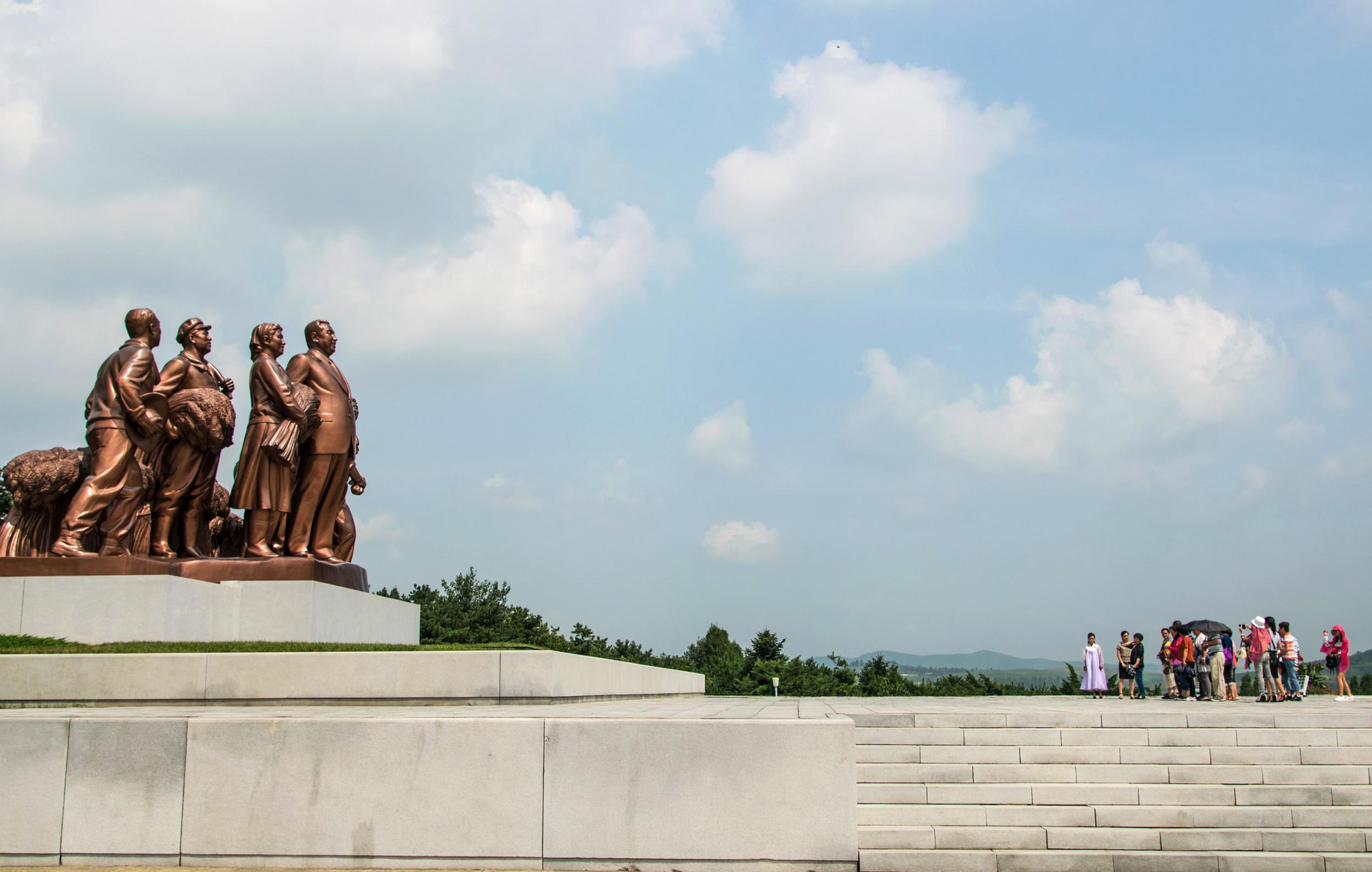 Tourists like these, visiting a ‘template’ farm village in Pyongyang, are morally wrong, says this writer