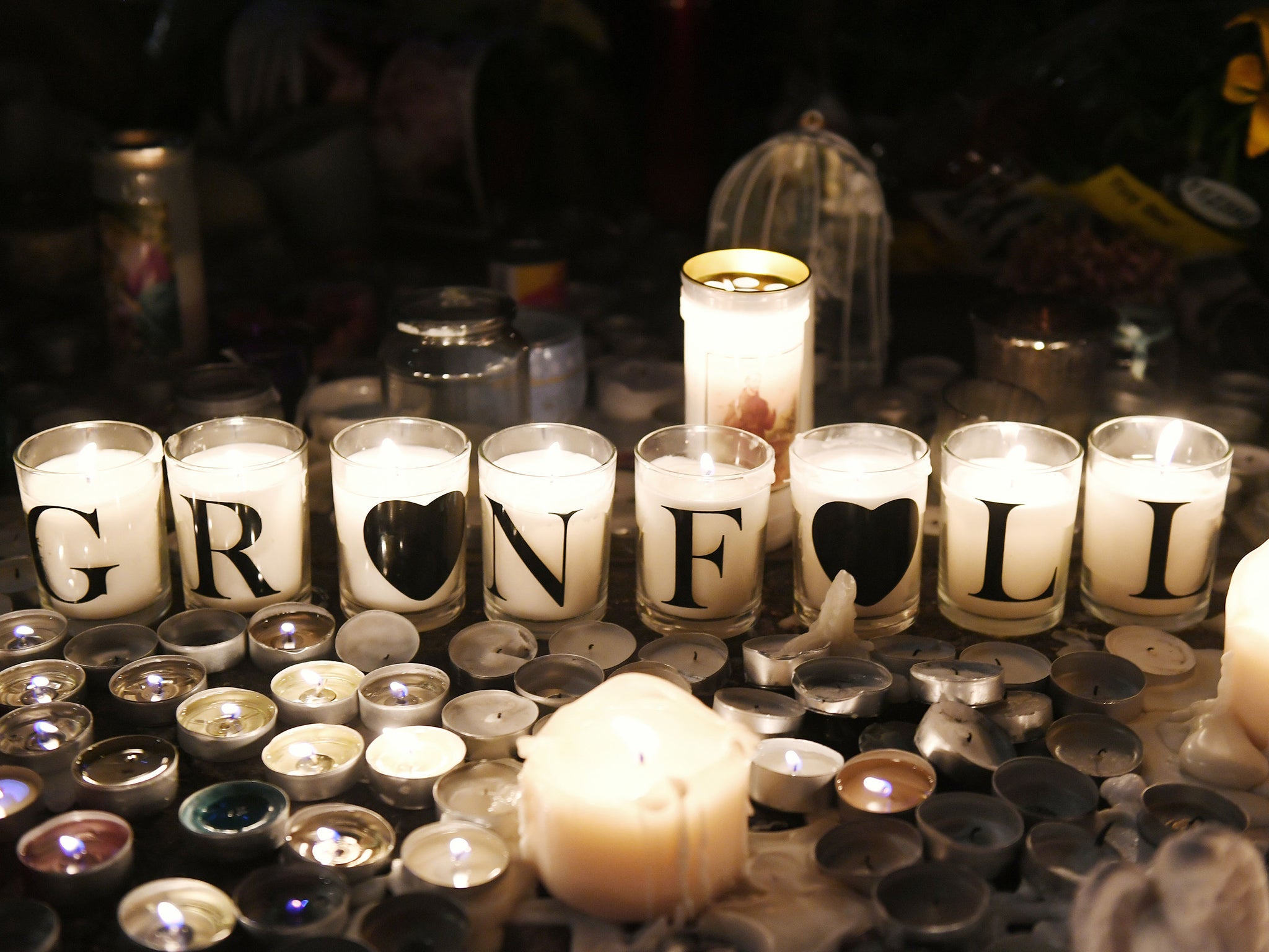 Tributes are left by Latymer Community Church, near to Grenfell Tower in west London after a fire engulfed the 24-storey building