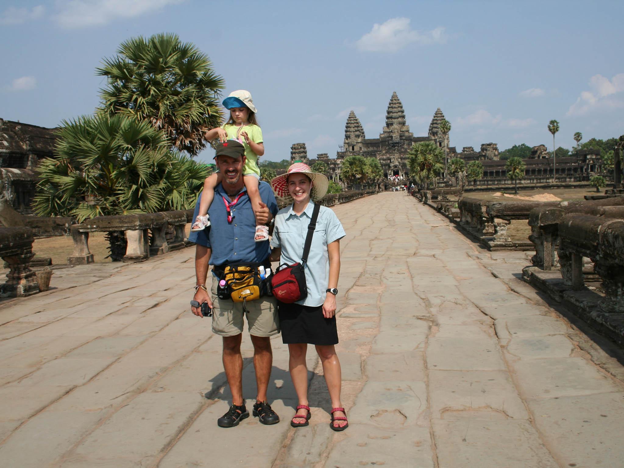 Living the dream: Grant Weatherill and Tamara Cassels with their daughter Jessica in Cambodia’s Angkor Wat