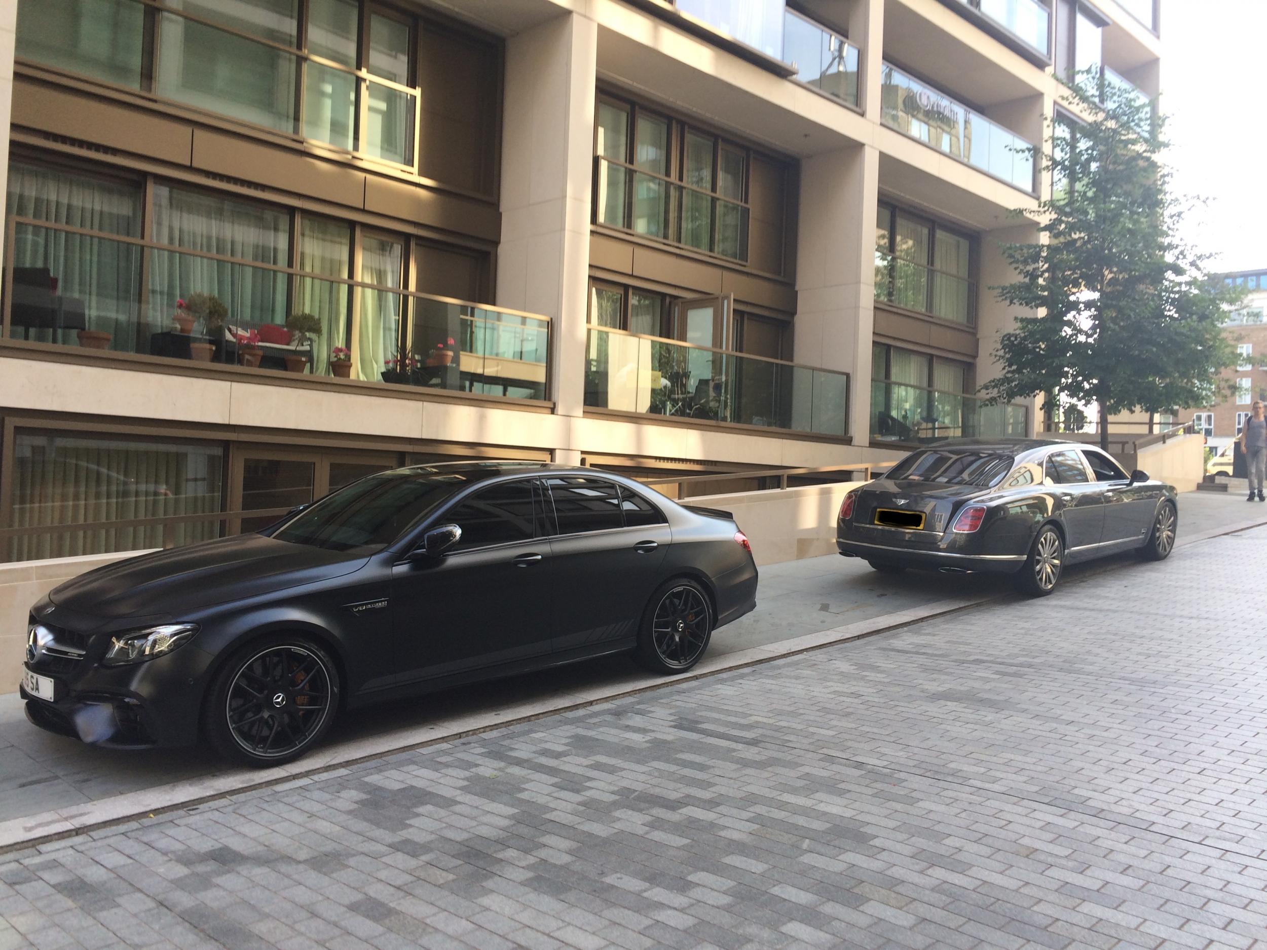 Some of the luxury cars parked on nearby side roads