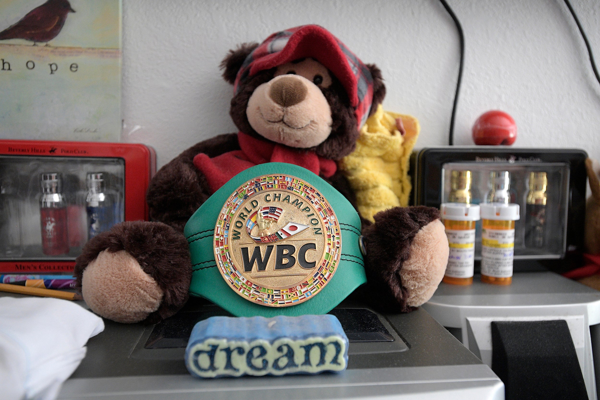 A replica championship belt sent by the WBC sits on a dresser in Prichard’s room