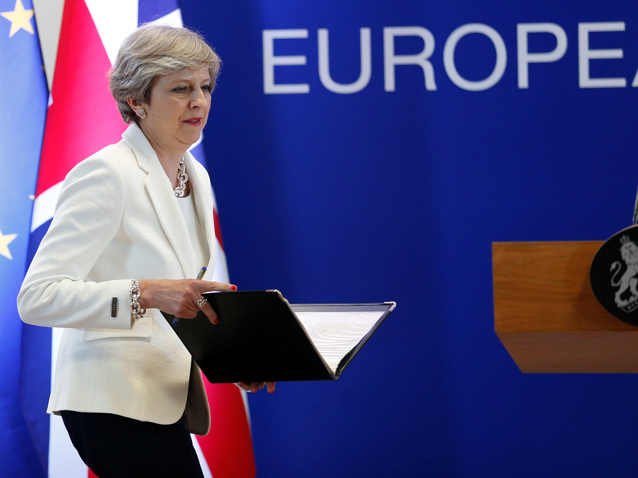 Theresa May arrives at a news conference at the EU summit in Brussels