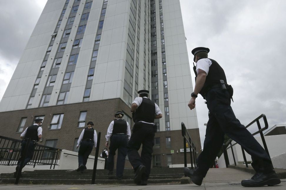 Police officers outside Dorney Tower, part of the Chalcots Estate in Camden where residents have been forced to evacuate