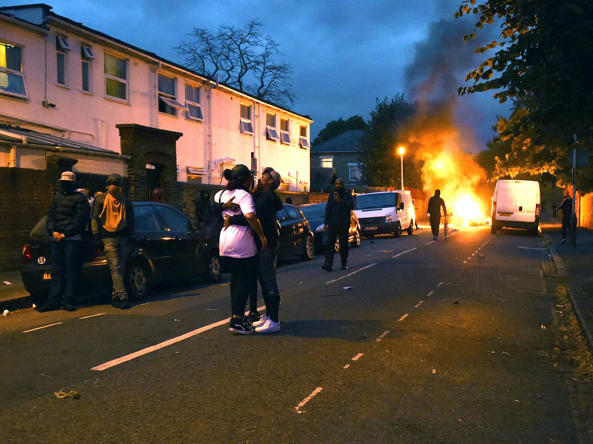 Campaigners face off with police in Richmond Road in Forest Gate, north east London, as they protest over the death of Edir Frederico Da Costa, who died on June 21 six days after he was stopped in a car by Metropolitan Police officers