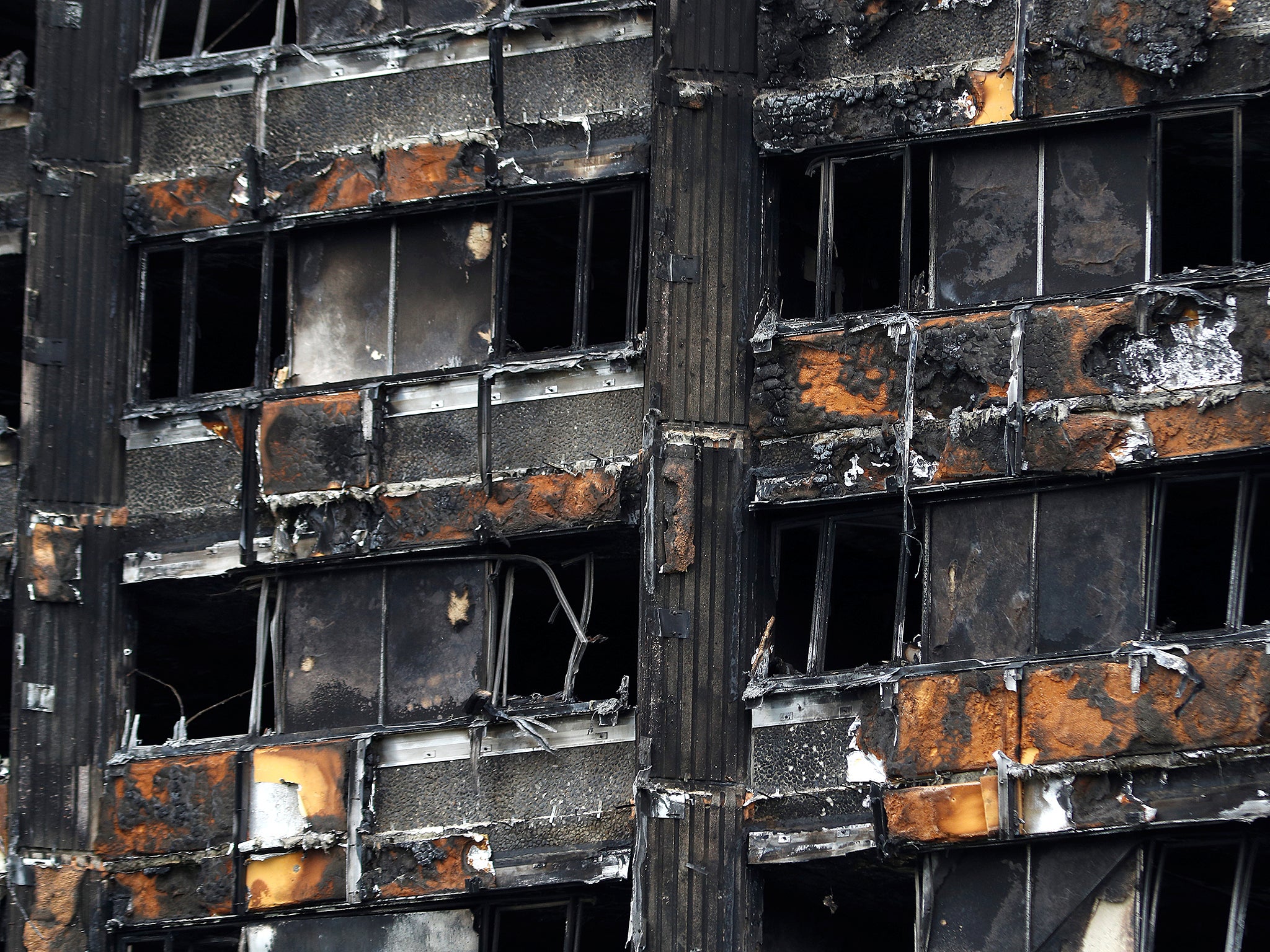 A damaged facade of Grenfell tower following the catastrophe in north Kensington