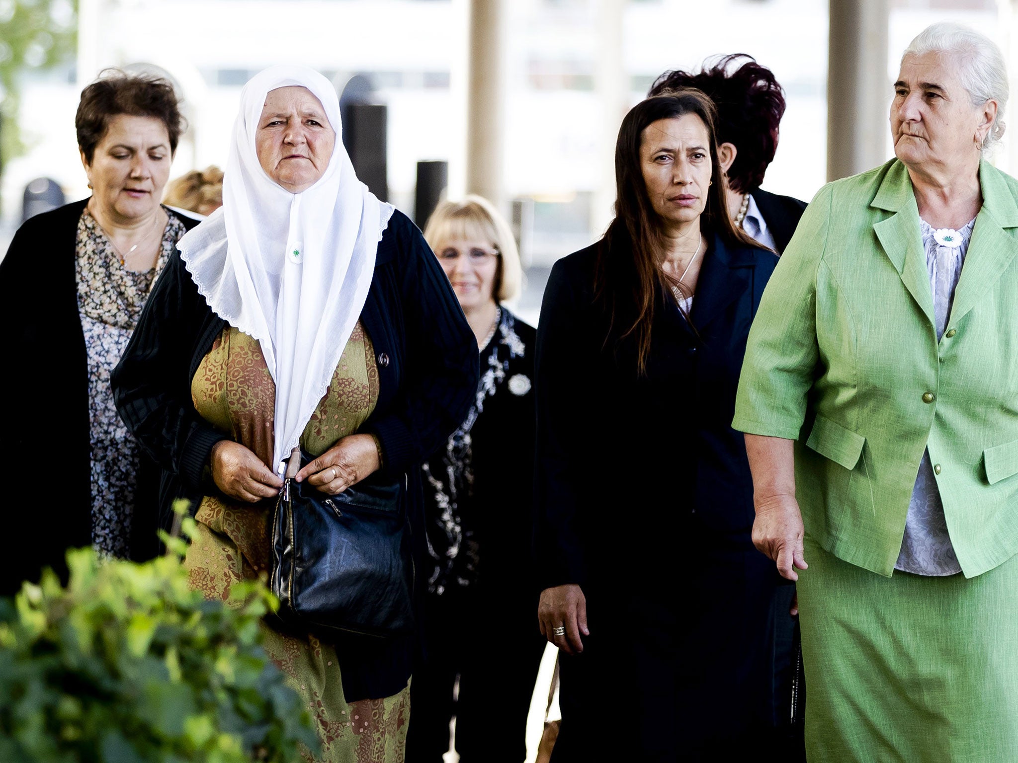 Bosnian women from the Srebrenica Mothers Association arrive at the Court of Justice in The Hague on Tuesday for the verdict of the appeal against the Dutch state