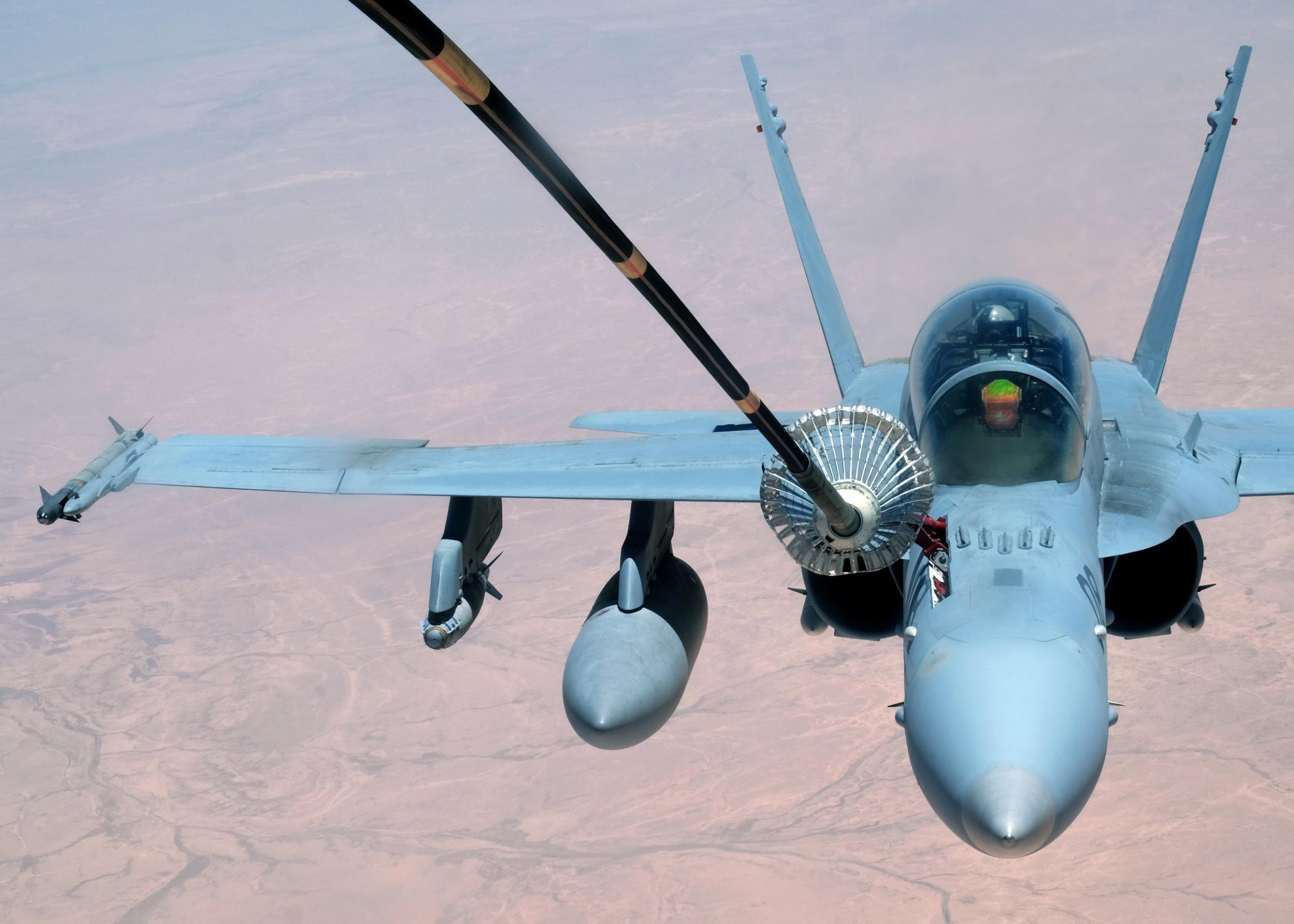 A US Marine Corps F-18 Super Hornet receives fuel from a 908th Expeditionary Air Refueling Squadron KC-10 Extender on 31 May 2017, over an undisclosed location above Syrian or Iraqi airspace