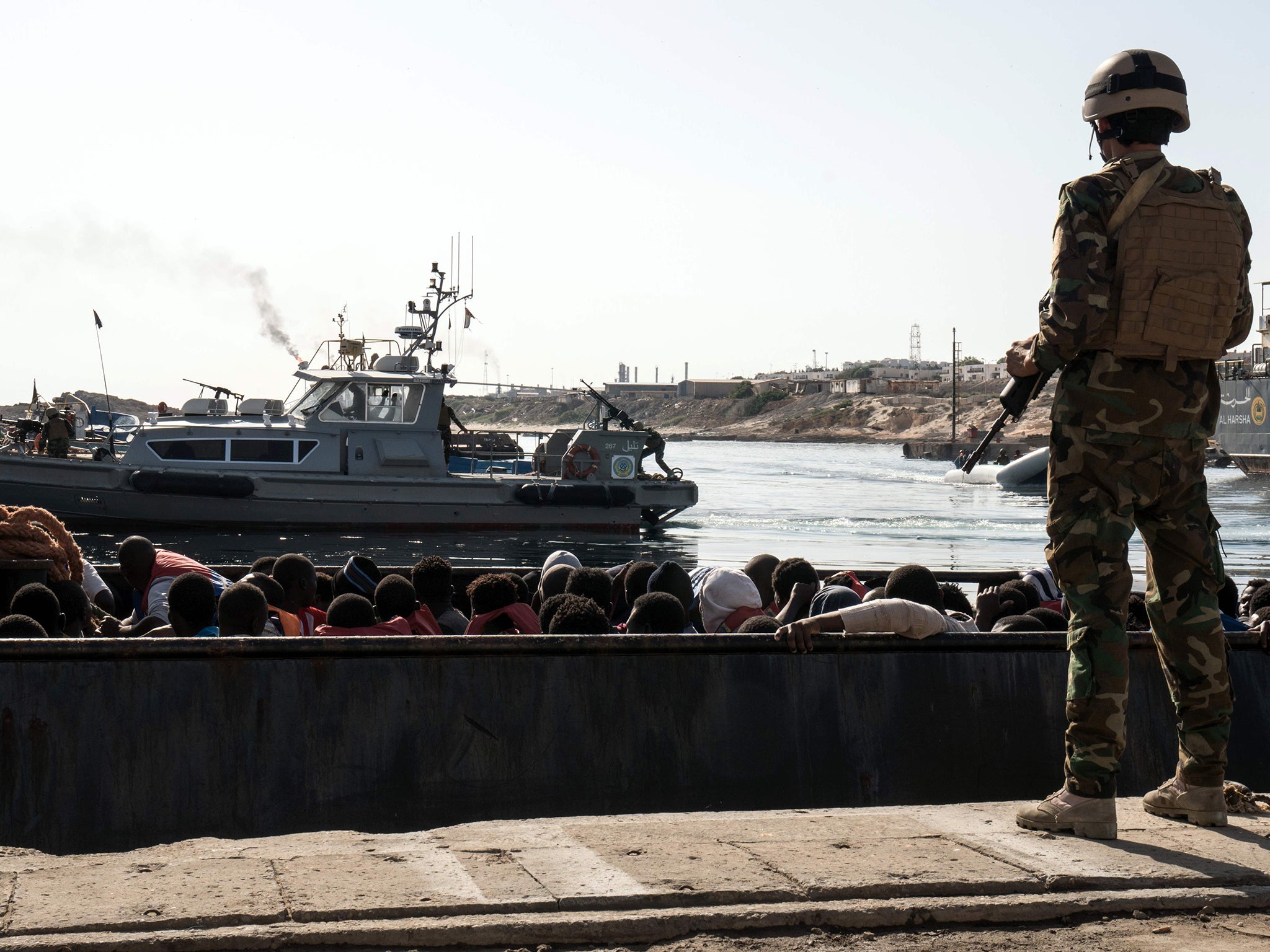 Migrants being held by Libyan forces in Tripoli