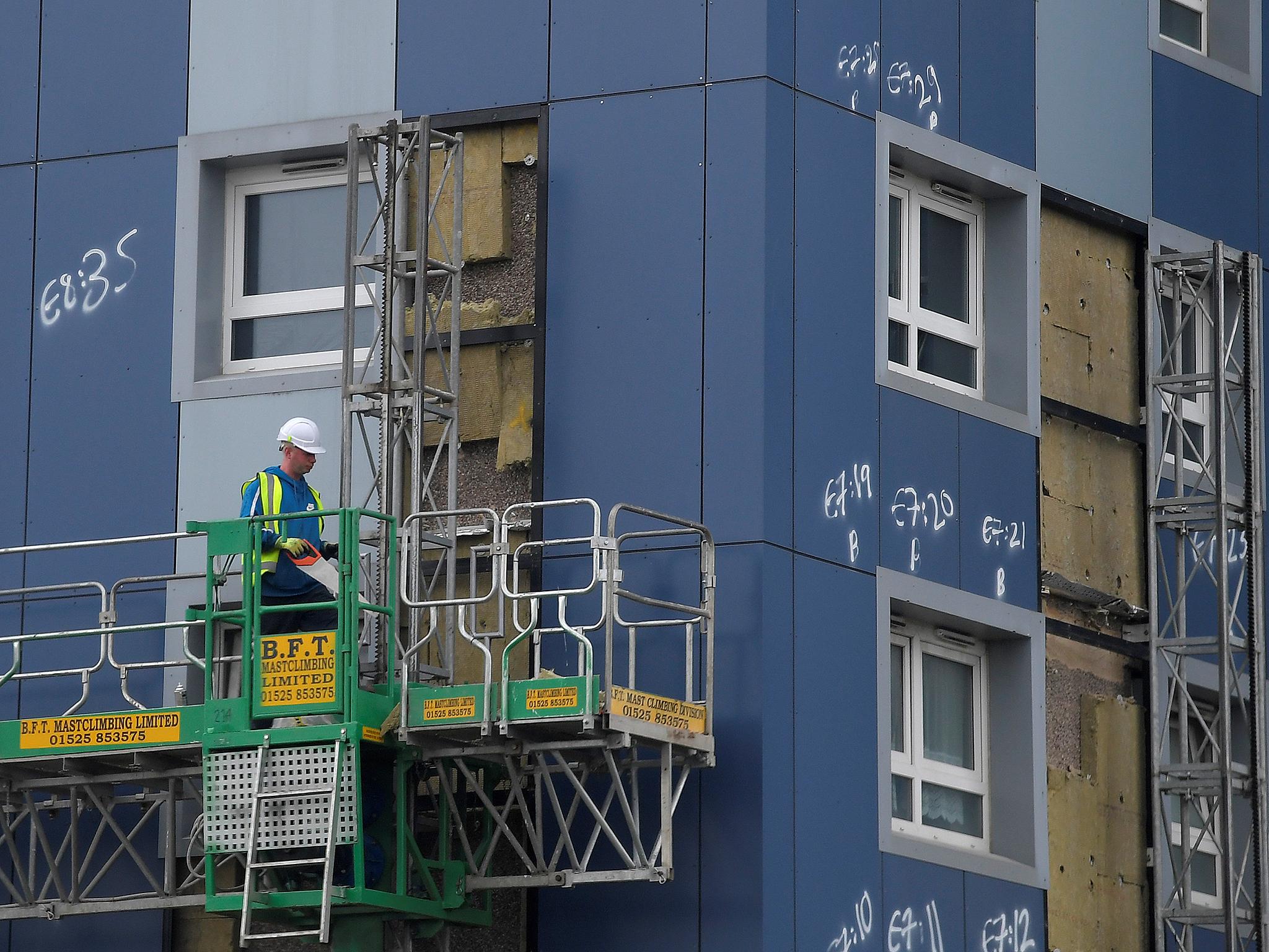 The cladding on one of the buildings has already been removed