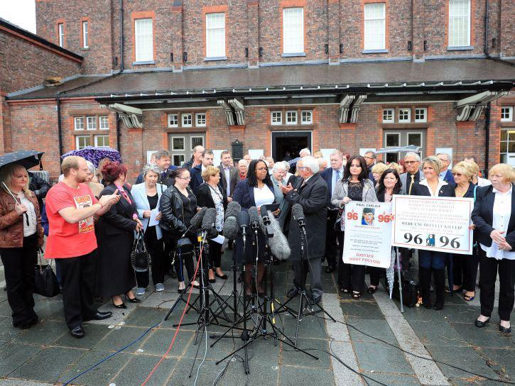 Friends and family of victims speak to the media outside Parr Hall, Warrington, where the Crown Prosecution Service said Hillsborough match commander David Duckenfield, former chief constable Sir Norman Bettison and four other individuals have been charged with offences relating to the Hillsborough disaster.