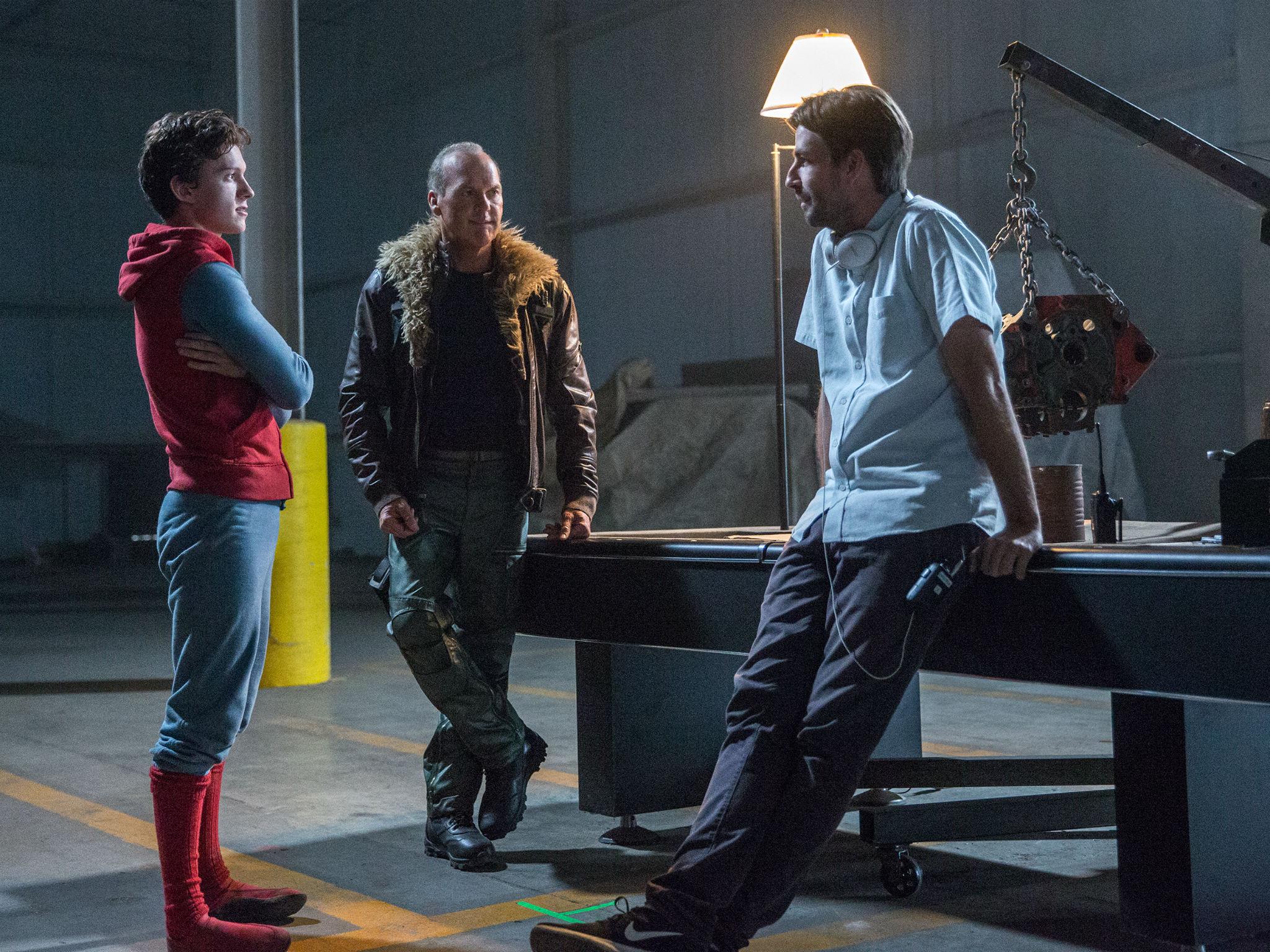 Director Watts (right) talking to Tom Holland (left) who plays Spider-Man on set of his movie