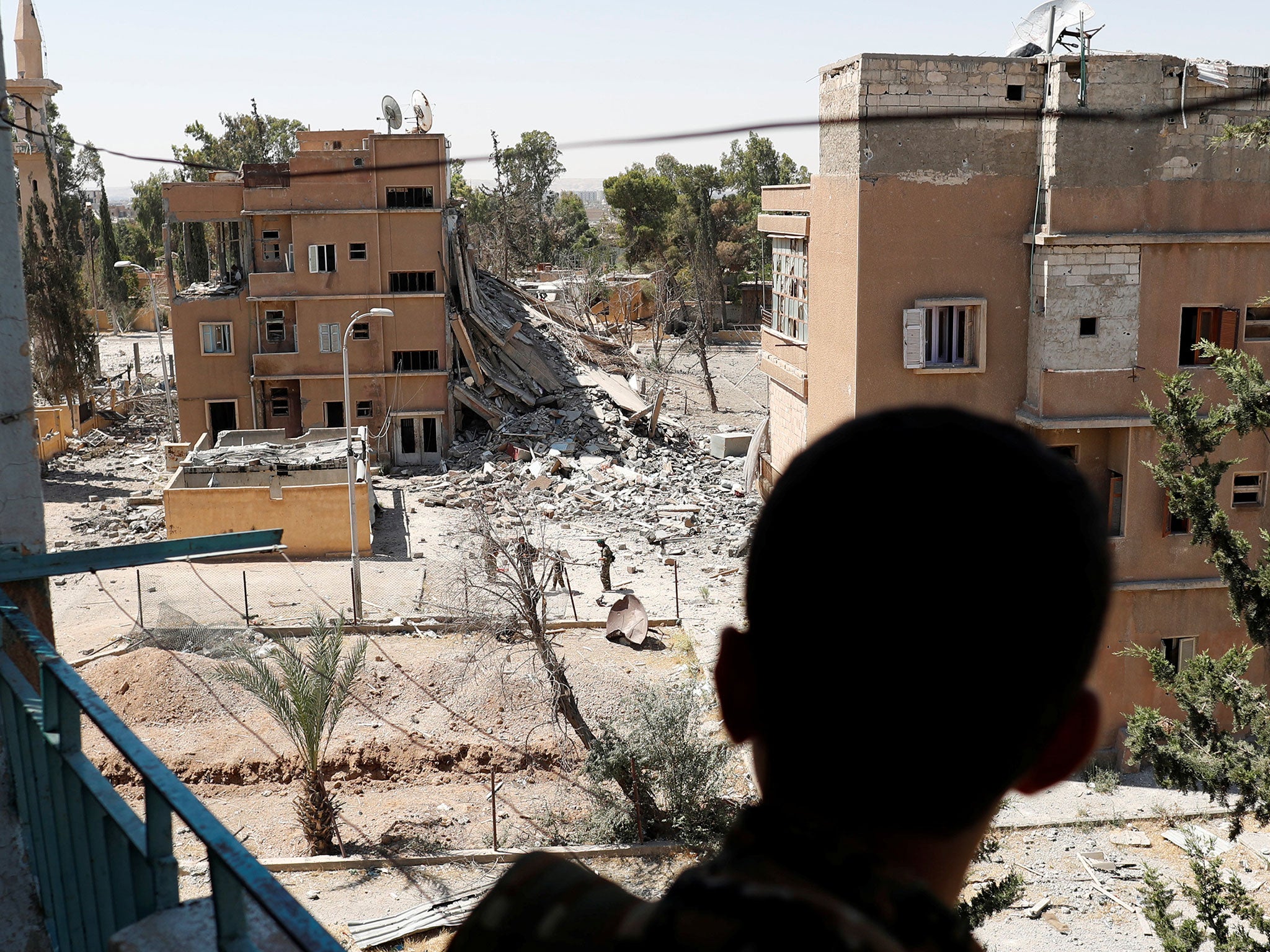 An SDF fighter holds his position in Raqqa