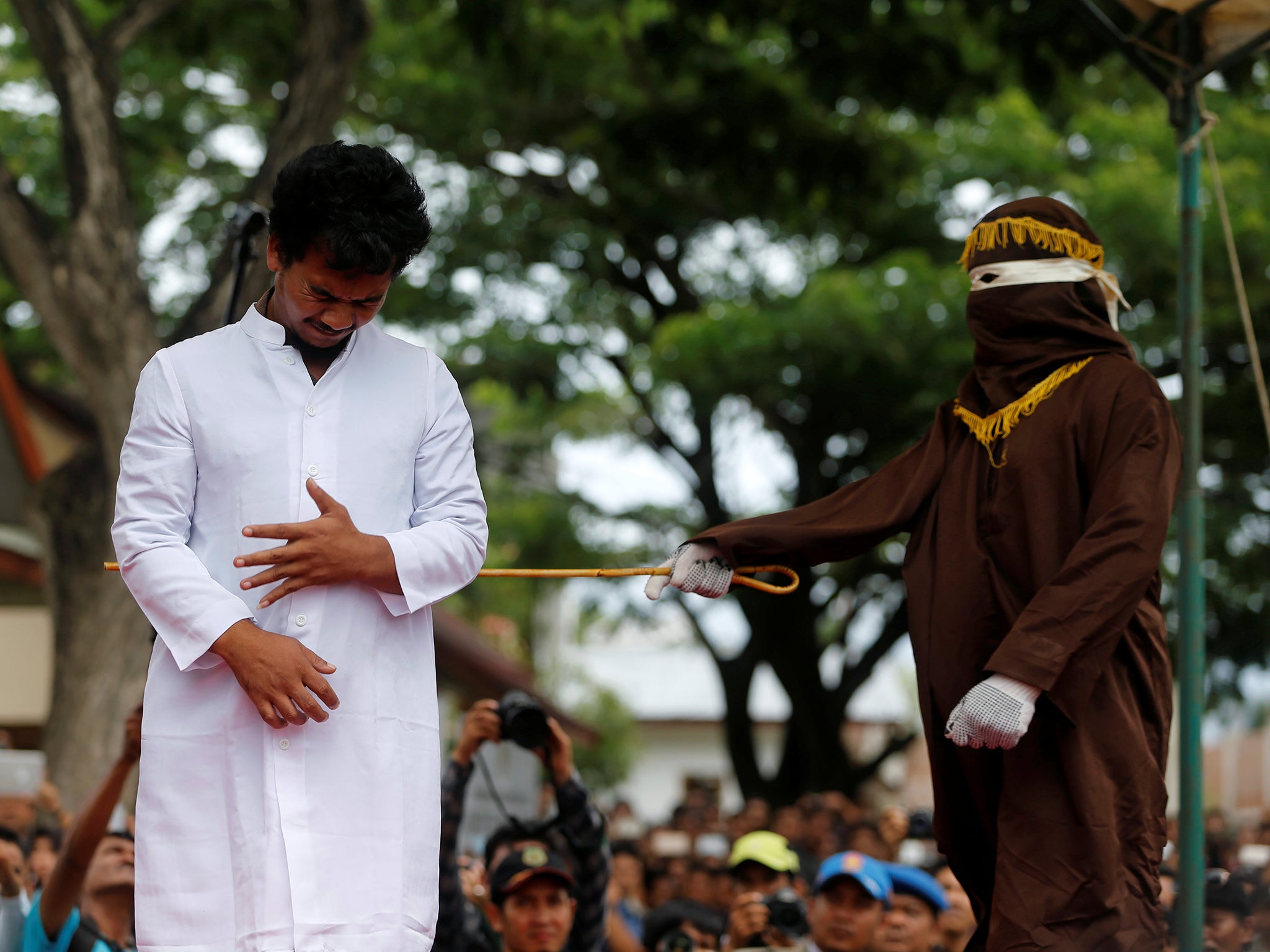 An Indonesian man is publicly caned for having gay sex