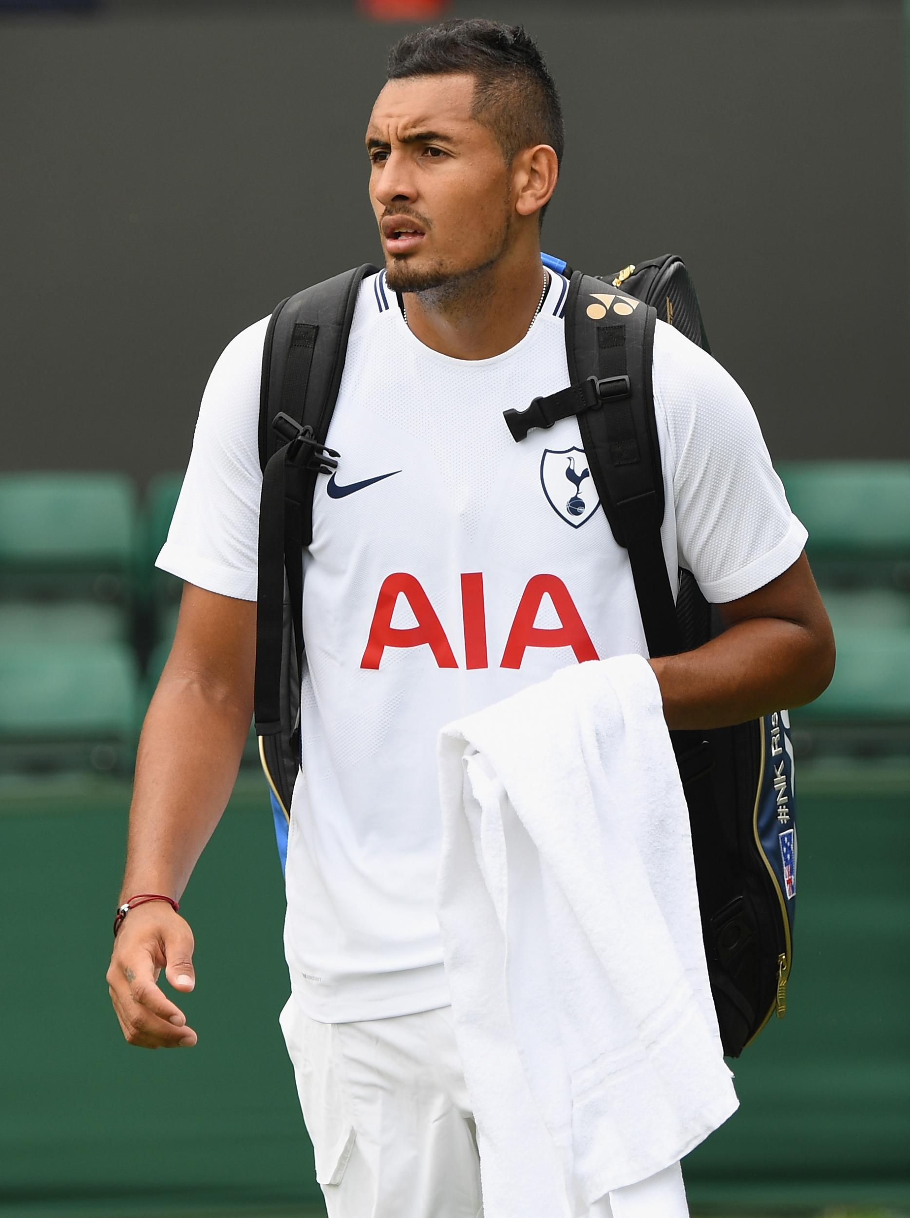 Kyrgios proudly sporting his new Spurs shirt