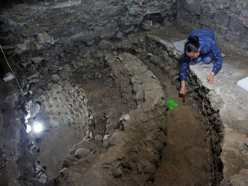 Archaeologist Lorena Vazquez works at the site