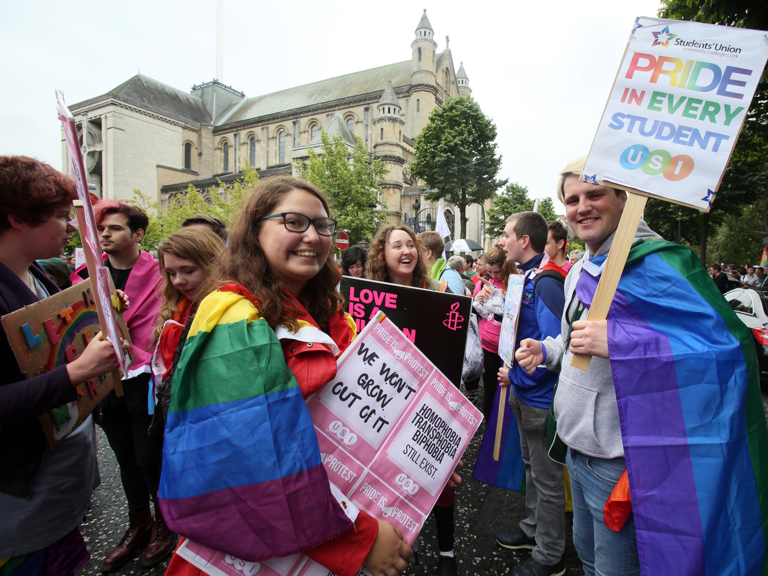 Gay rights campaigners take part in a march through Belfast on 1 July to protest against the ban on same-sex marriage