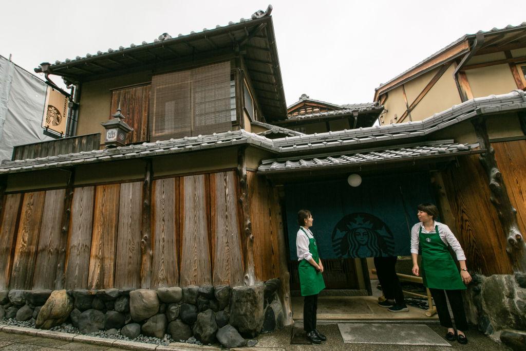 Rather than a Starbucks sign, the café has opted for deep green noren door curtains that bare the company logo