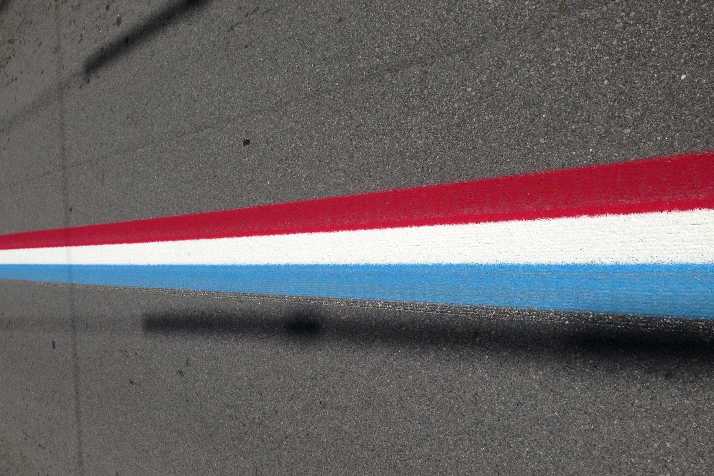 Red, white and blue stripes are painted on Bristol's roads year-round