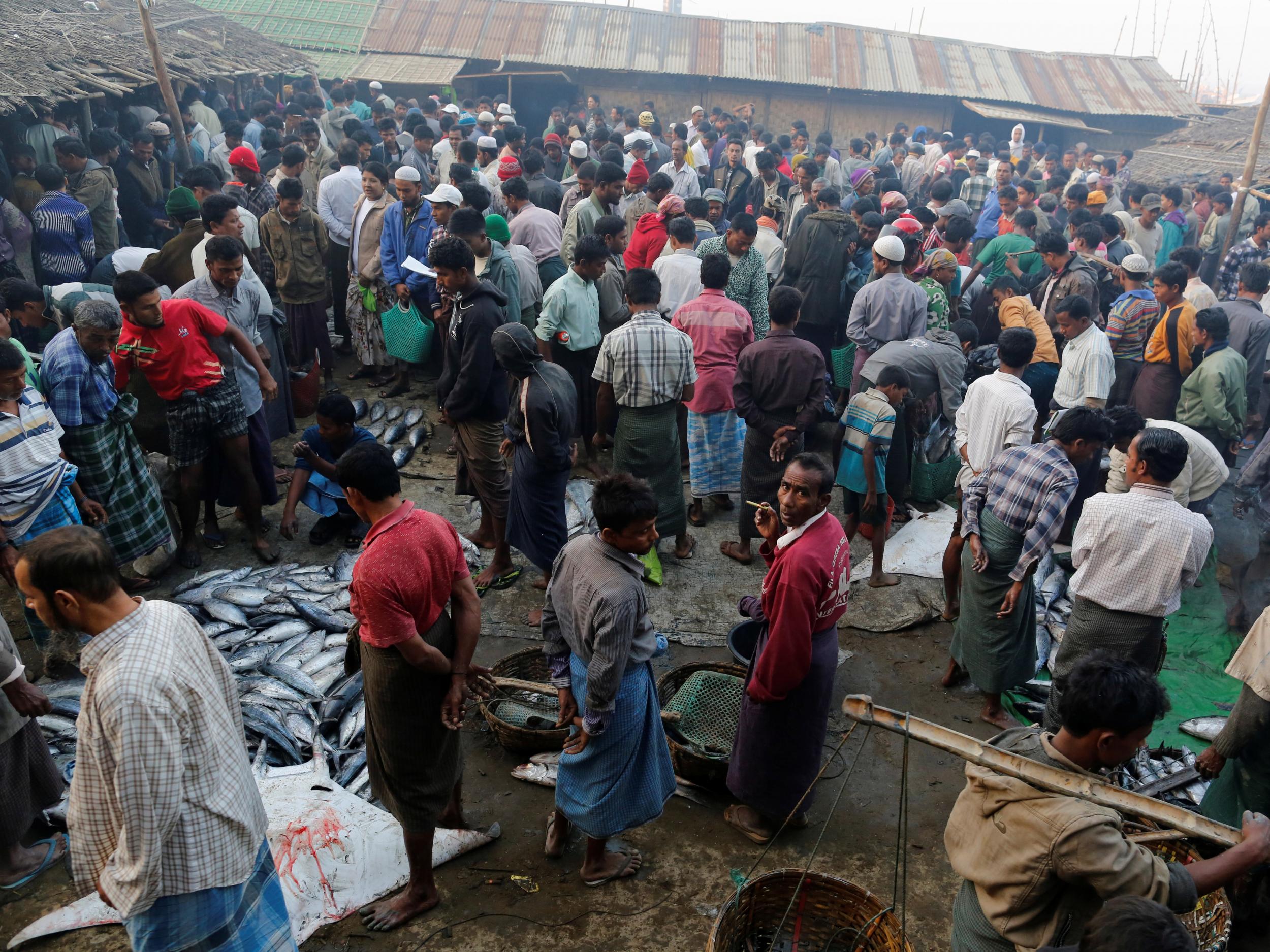 Rohingya men at Sittwe's bustling fish market in Rakhine, Burma