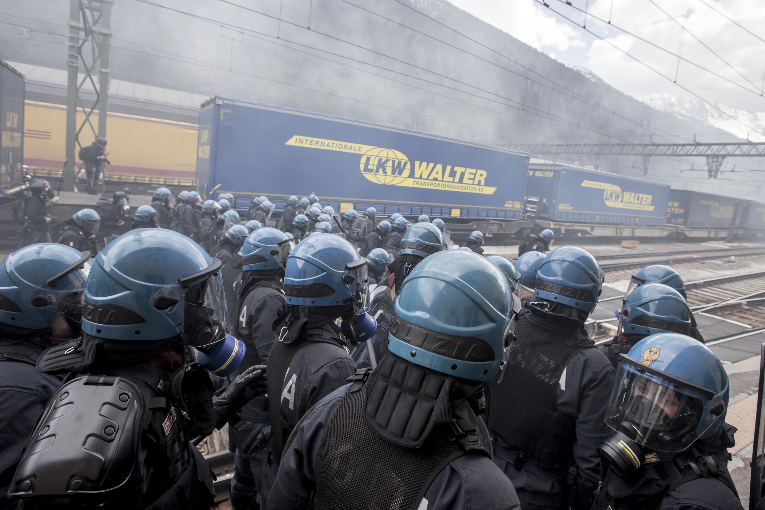 Riot police clash with protesters during a rally against the Austrian government's planned re-introduction of border controls