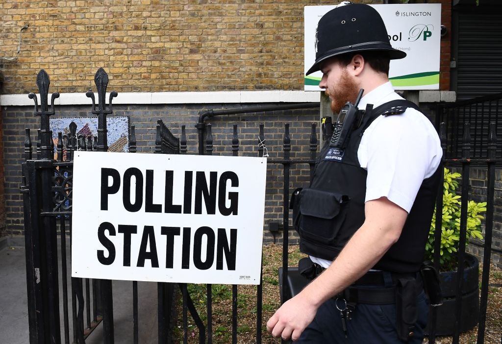 A police officer arrives at a polling station in London on 8 June 2017