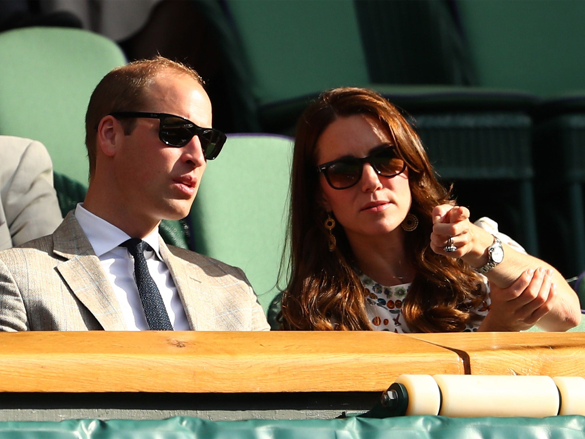 Two upper-class people enjoying Wimbledon, the home of overpriced fruit