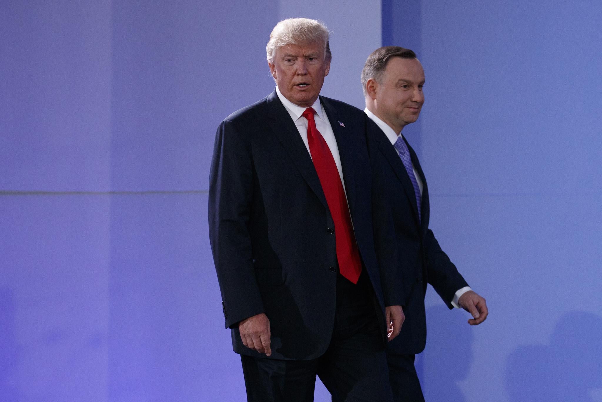 President Donald Trump and Polish President Andrzej Duda arrive for a news conference in Warsaw