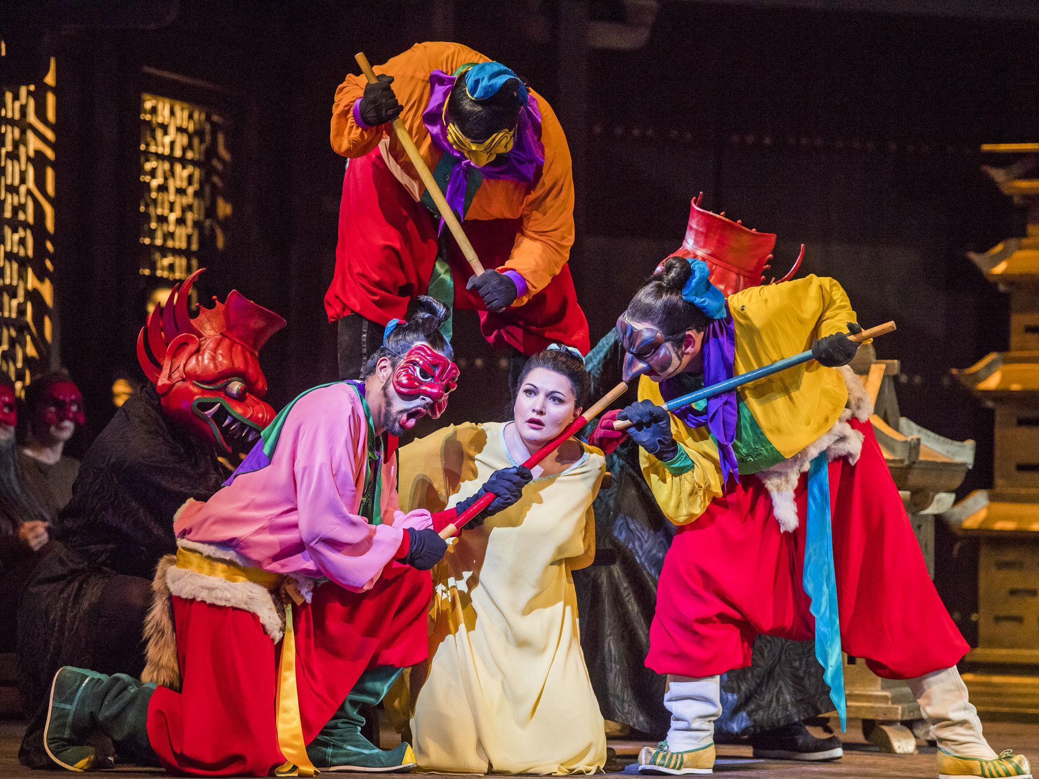 Michel de Souza (Ping), Pavel Petrov (Pong), Hibla Gerzmava (Liu) and Aled Hall (Pang) in 'Turandot' at the Royal Opera House