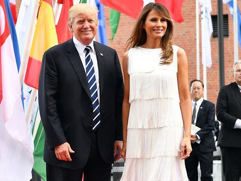 US President Donald J. Trump (L) and his wife Melania Trump (R) pose on the red carpet as they attend to a concert at the 'Elbphilharmonie' as part of the G20 summit in Hamburg, Germany, 07 July 2017.