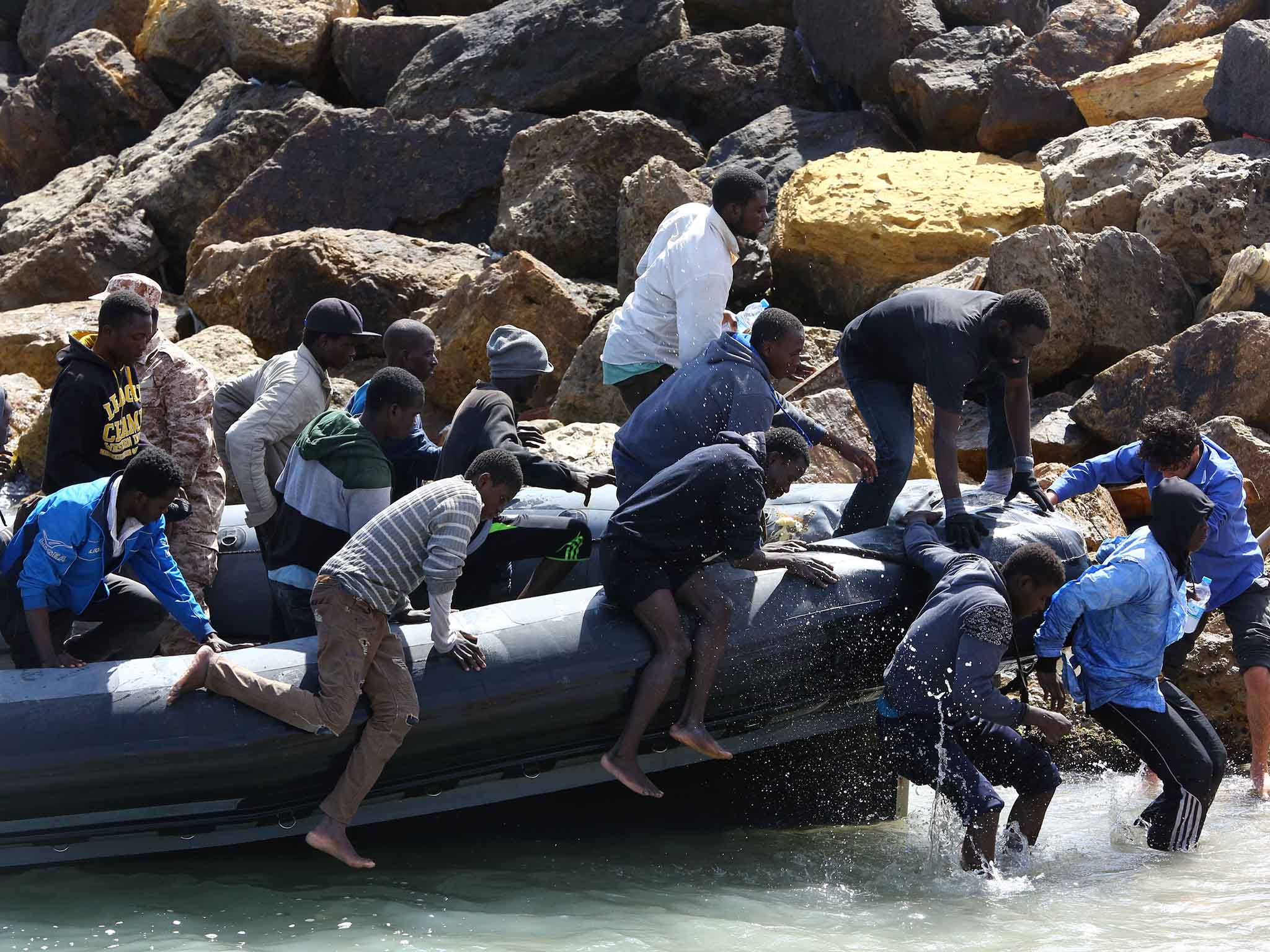 Illegal migrants from Africa arrive on shore after being rescued by Libyan coast guards